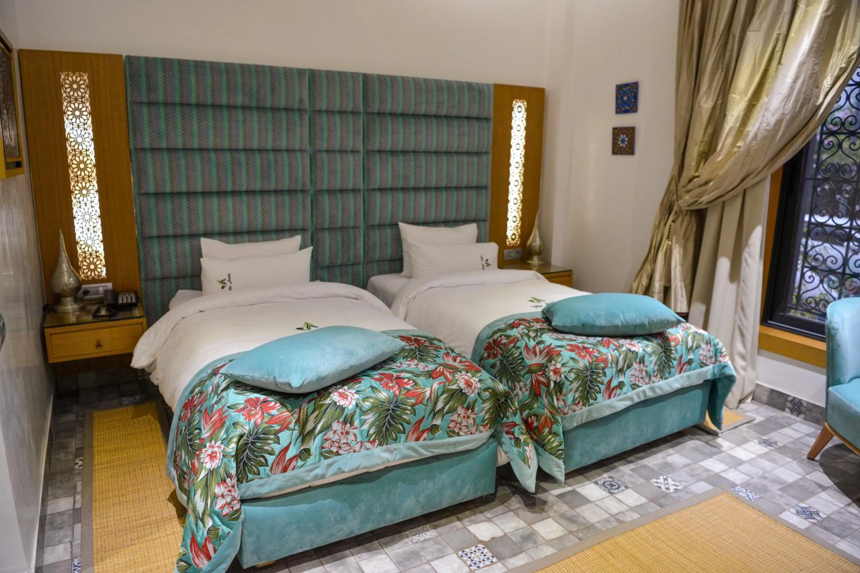 Bed in Aralia Boutique Hôtel