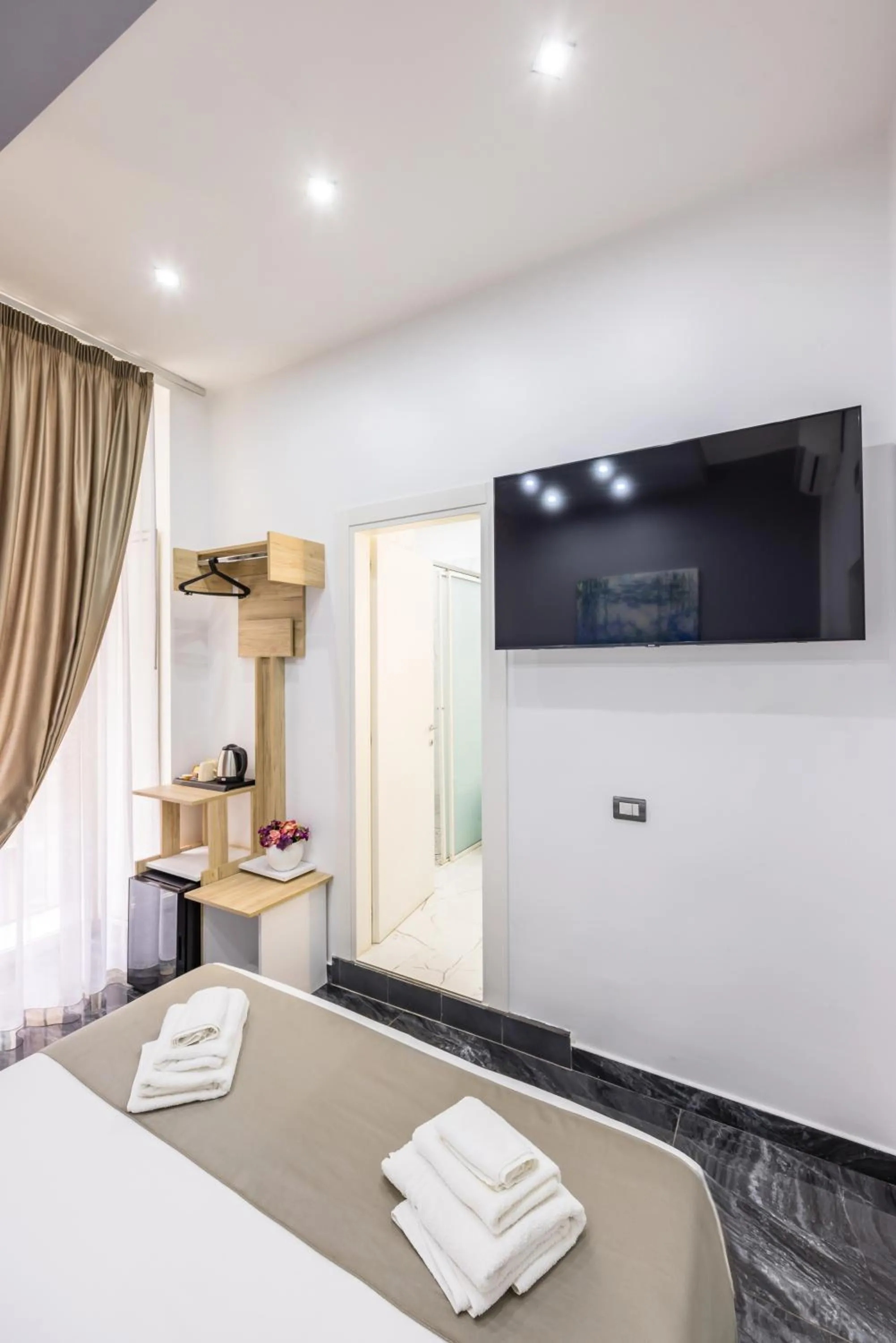 Bed in Bella Napoli Suites