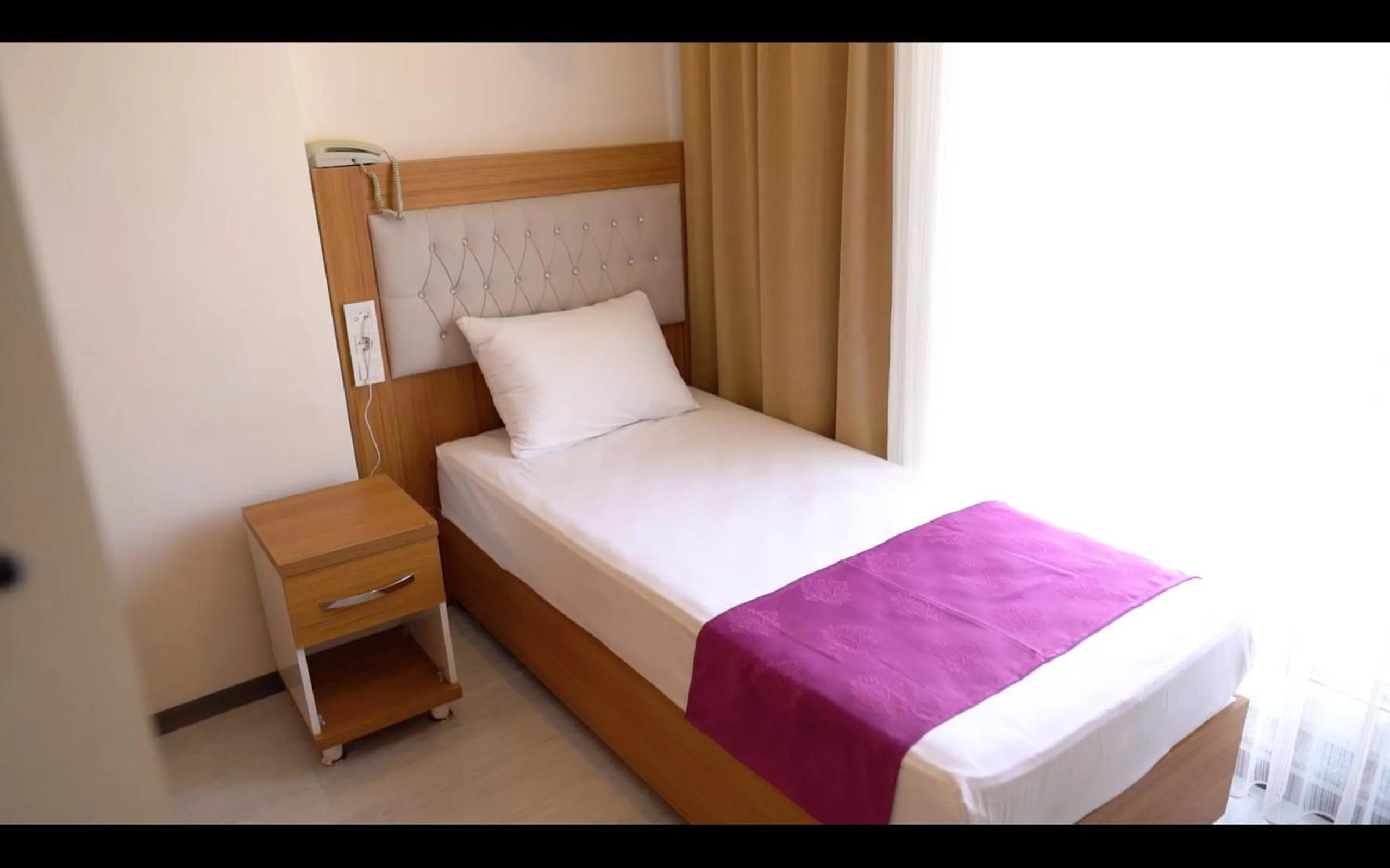 Bed in GÜVEN HOTEL