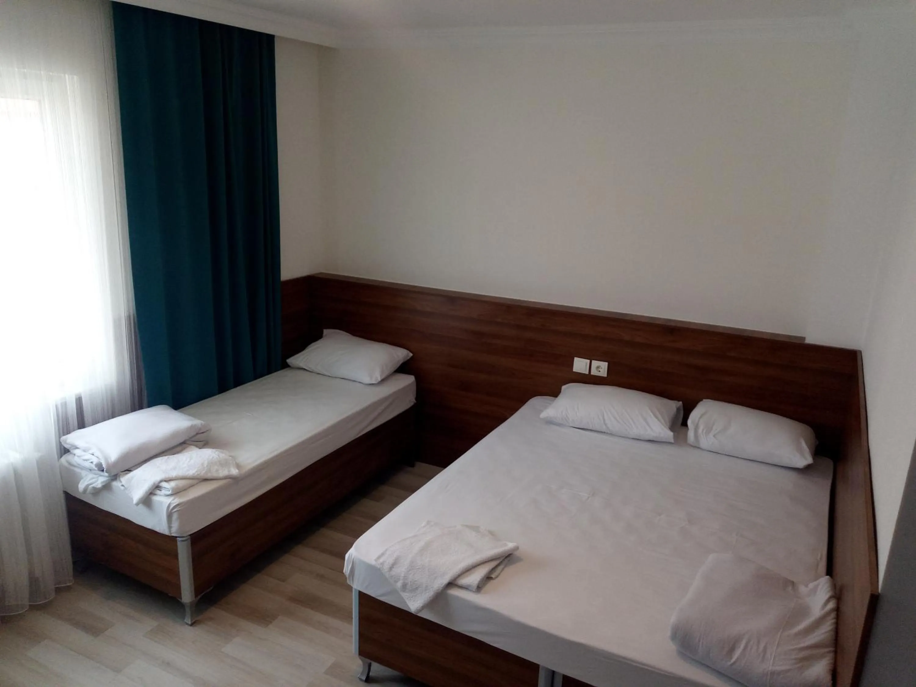 Bed in GÜVEN HOTEL