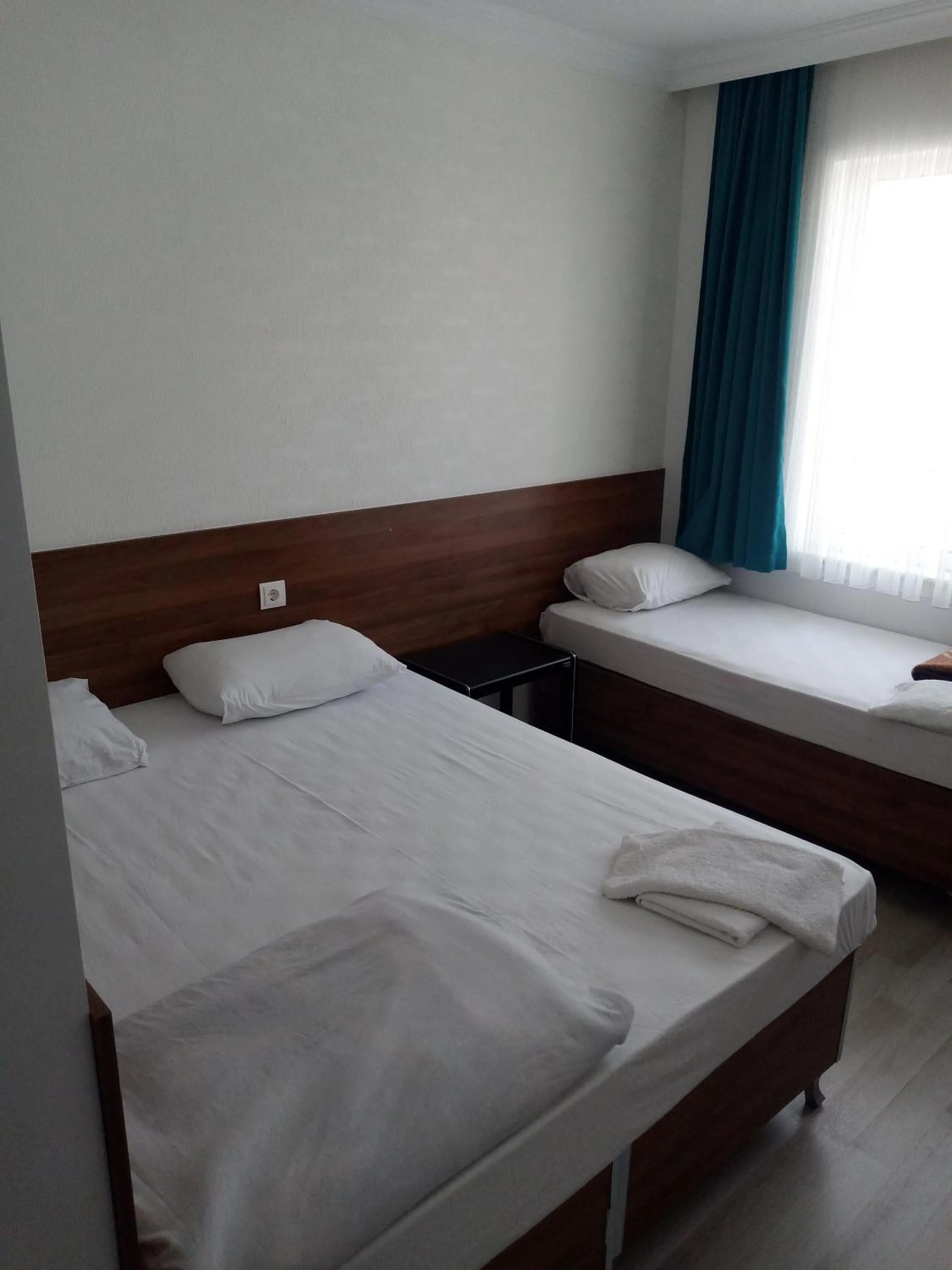 Bed in GÜVEN HOTEL