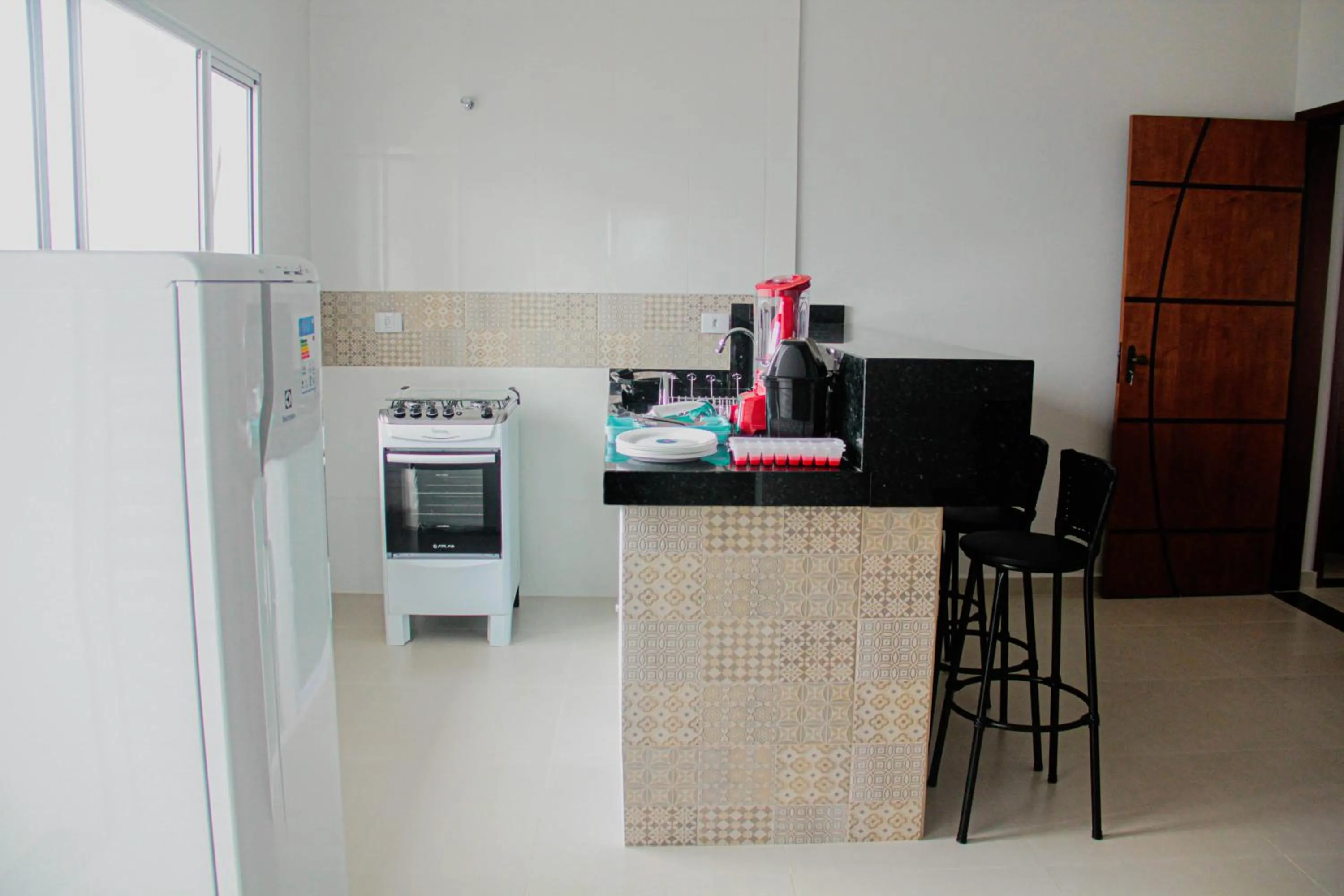 Communal kitchen in Souza Reis Apart - Unidade 1