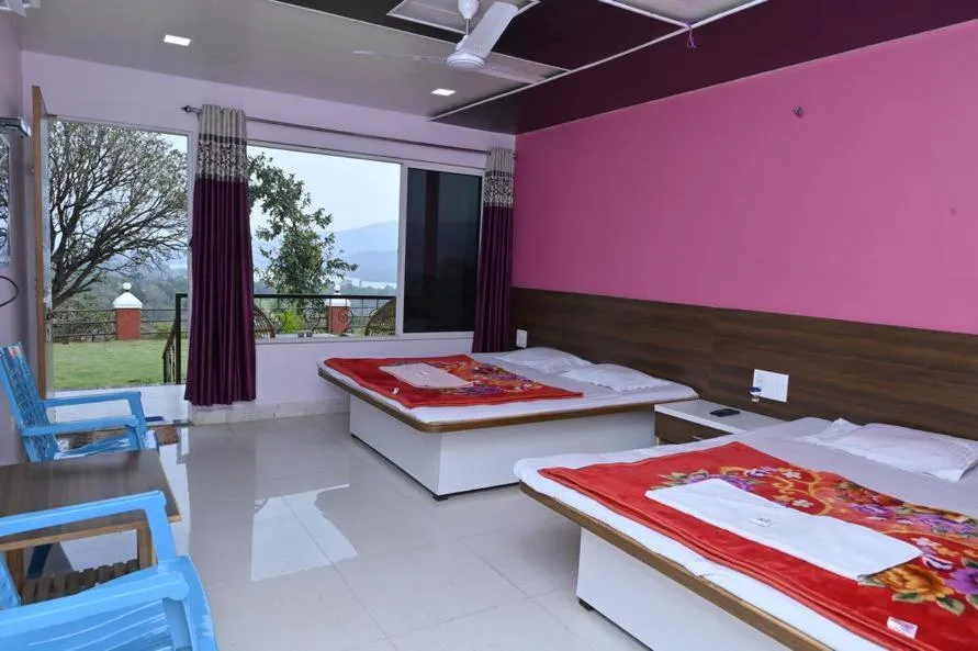 Bed in Shivshrushti Agro Tourism & River Camp Tapola