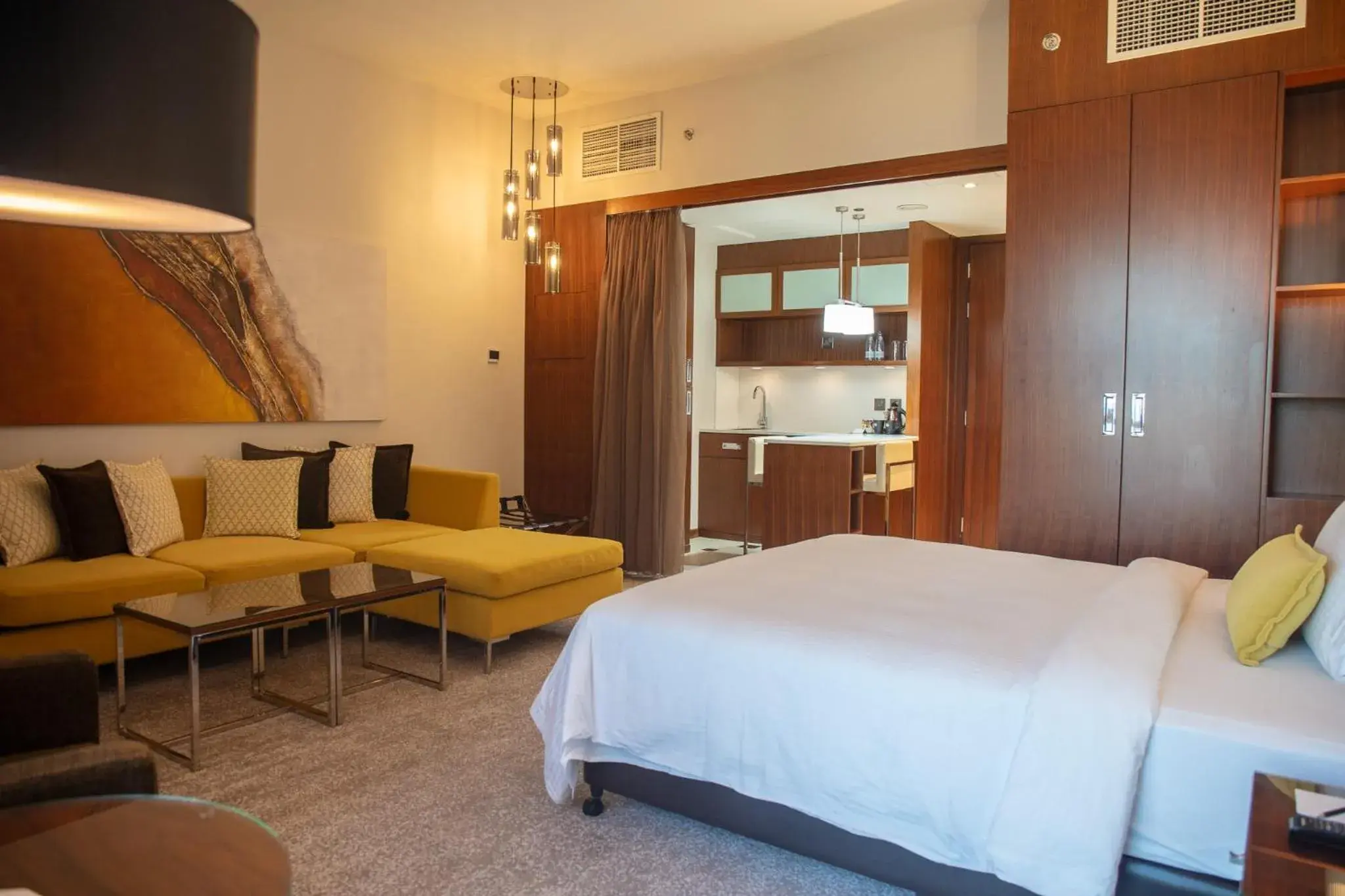 Seating area, Bed in Centro Corniche Al Khobar by Rotana Seating area, Bed in Centro Corniche Al Khobar by Rotana