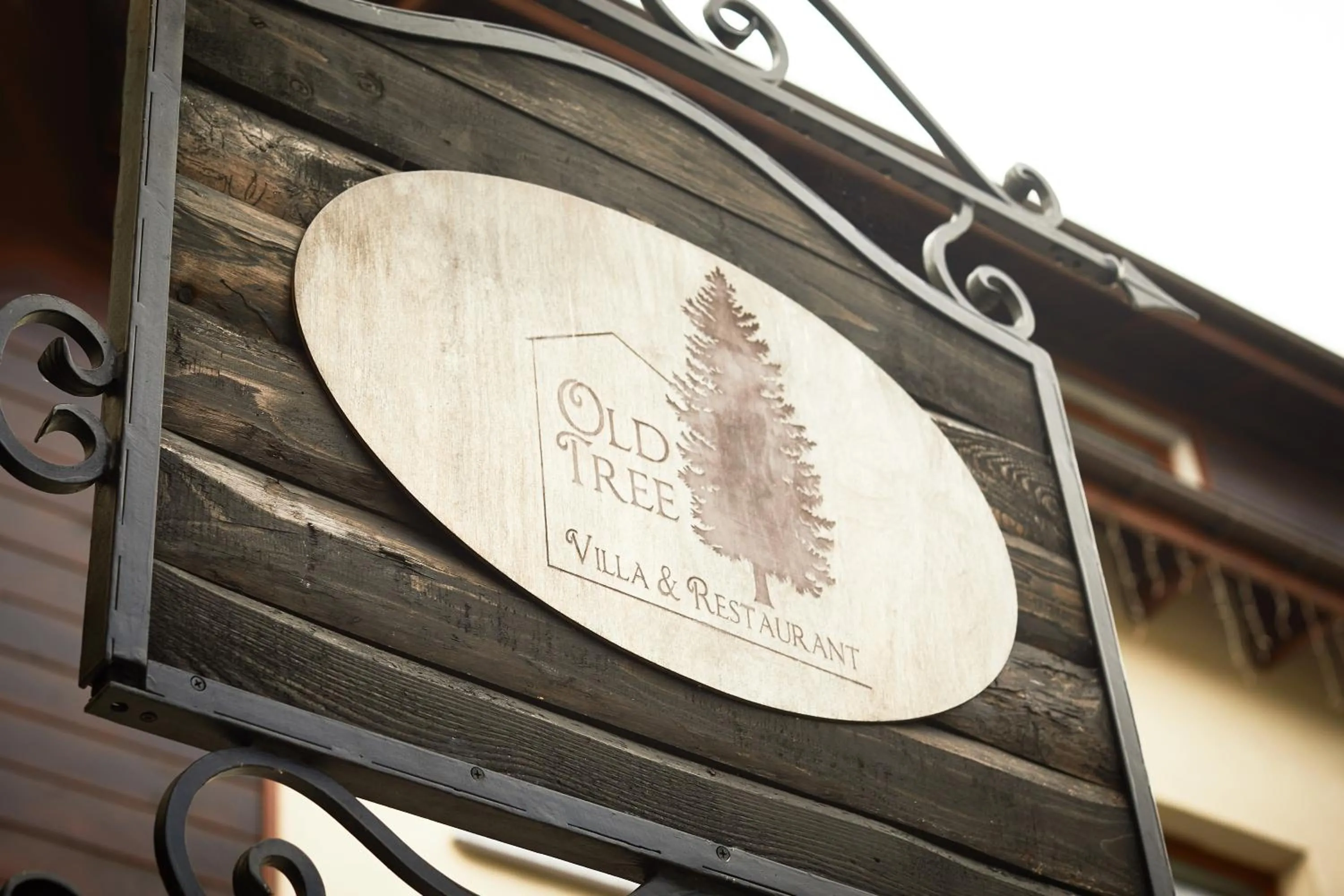Property logo or sign in Old Tree Villa & Restaurant
