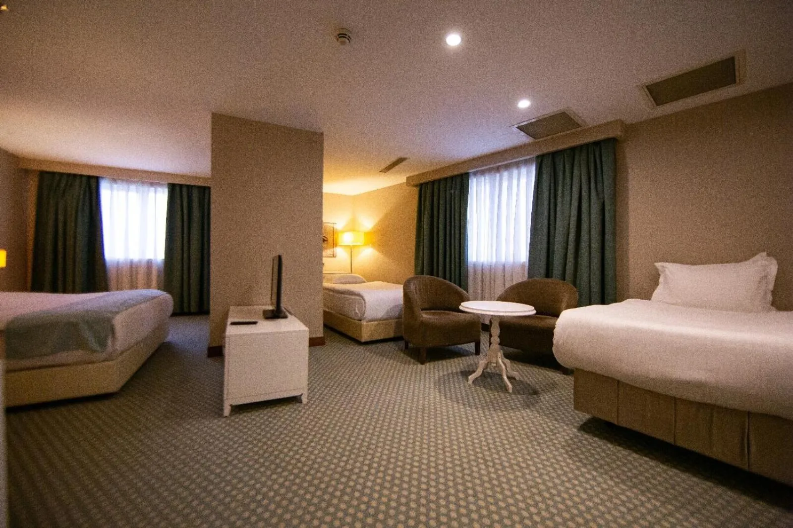 Bed in Nevali Hotel & Convention Center