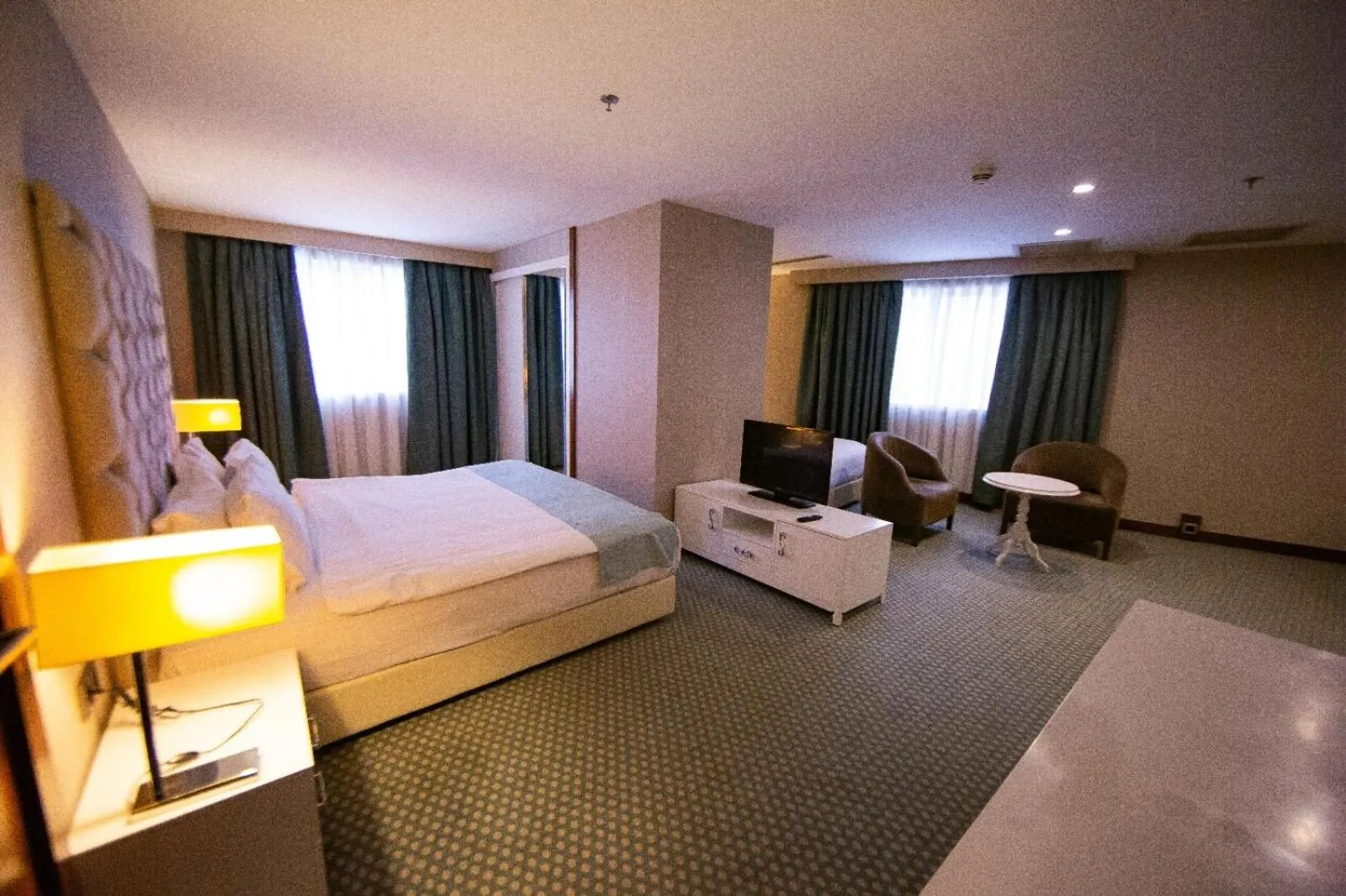 Bed in Nevali Hotel & Convention Center