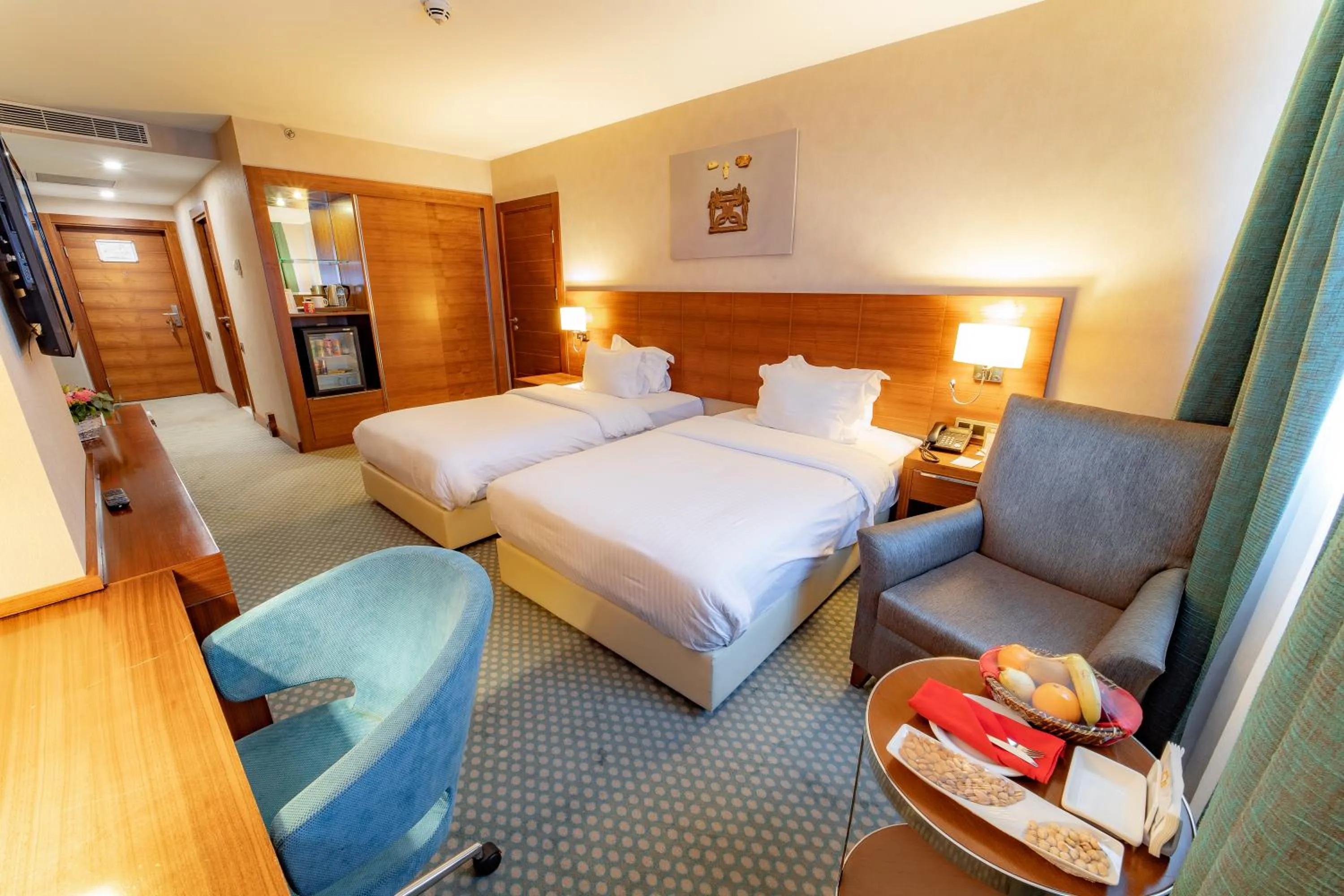 Bed in Nevali Hotel & Convention Center