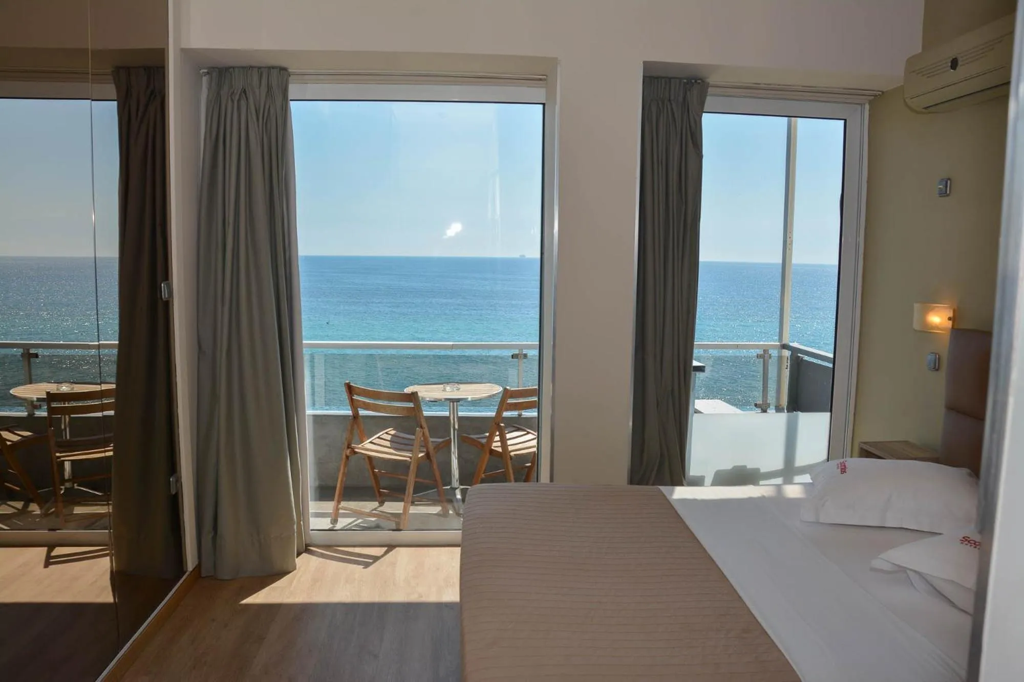 Bed in Scorpios Sea Side Hotel