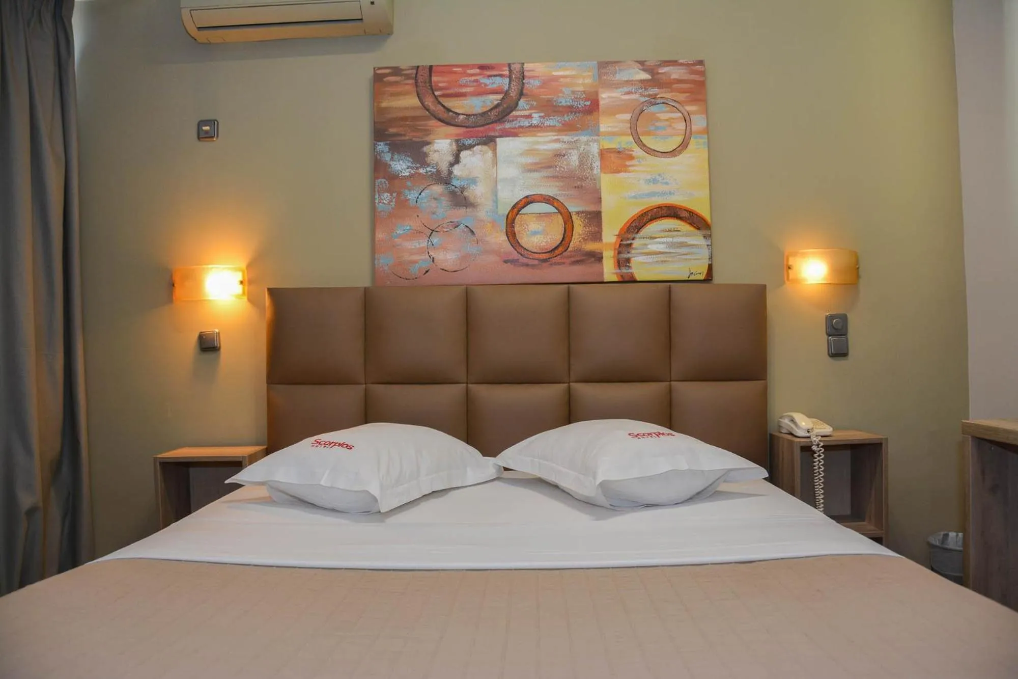 Bed in Scorpios Sea Side Hotel