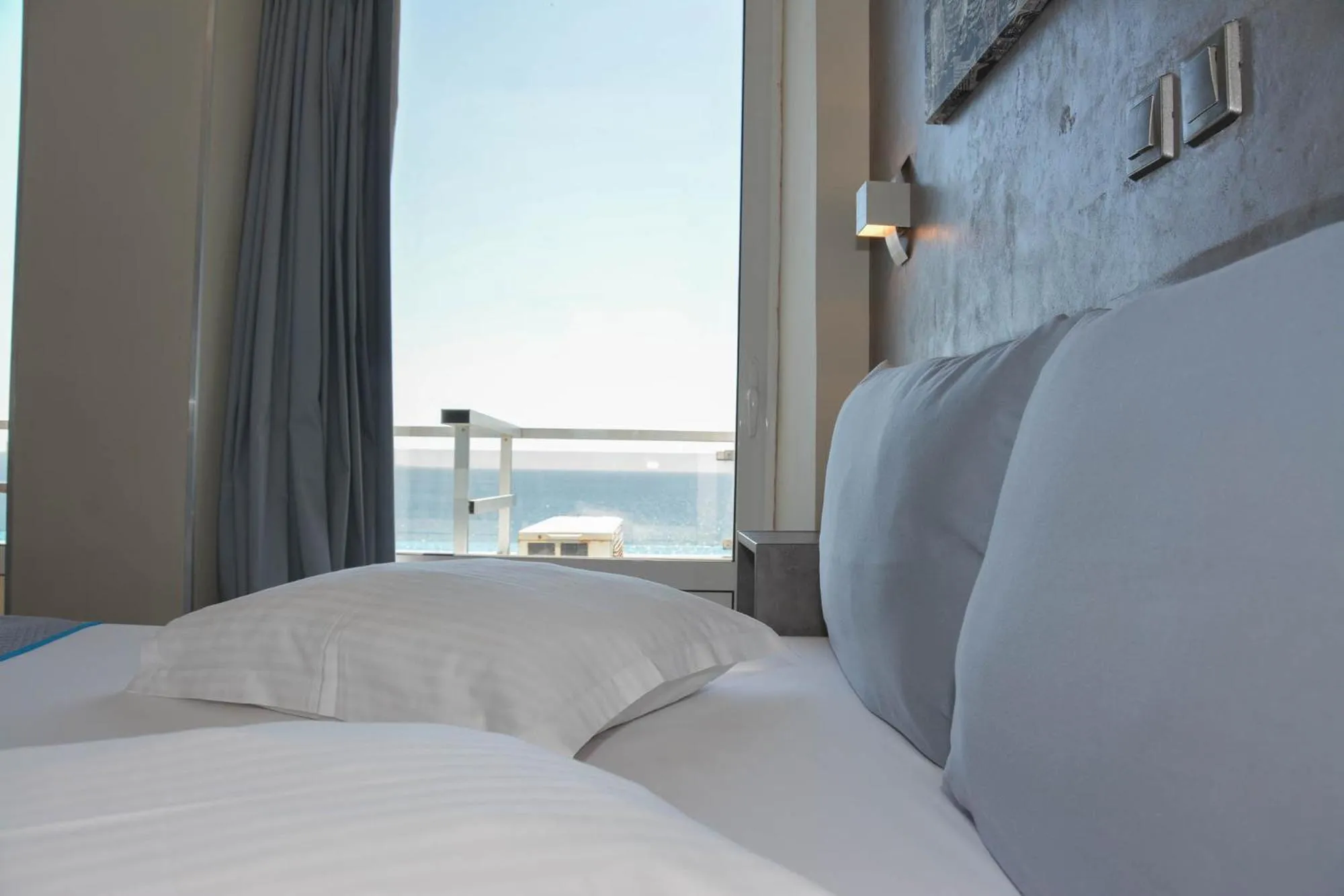 Bed in Scorpios Sea Side Hotel