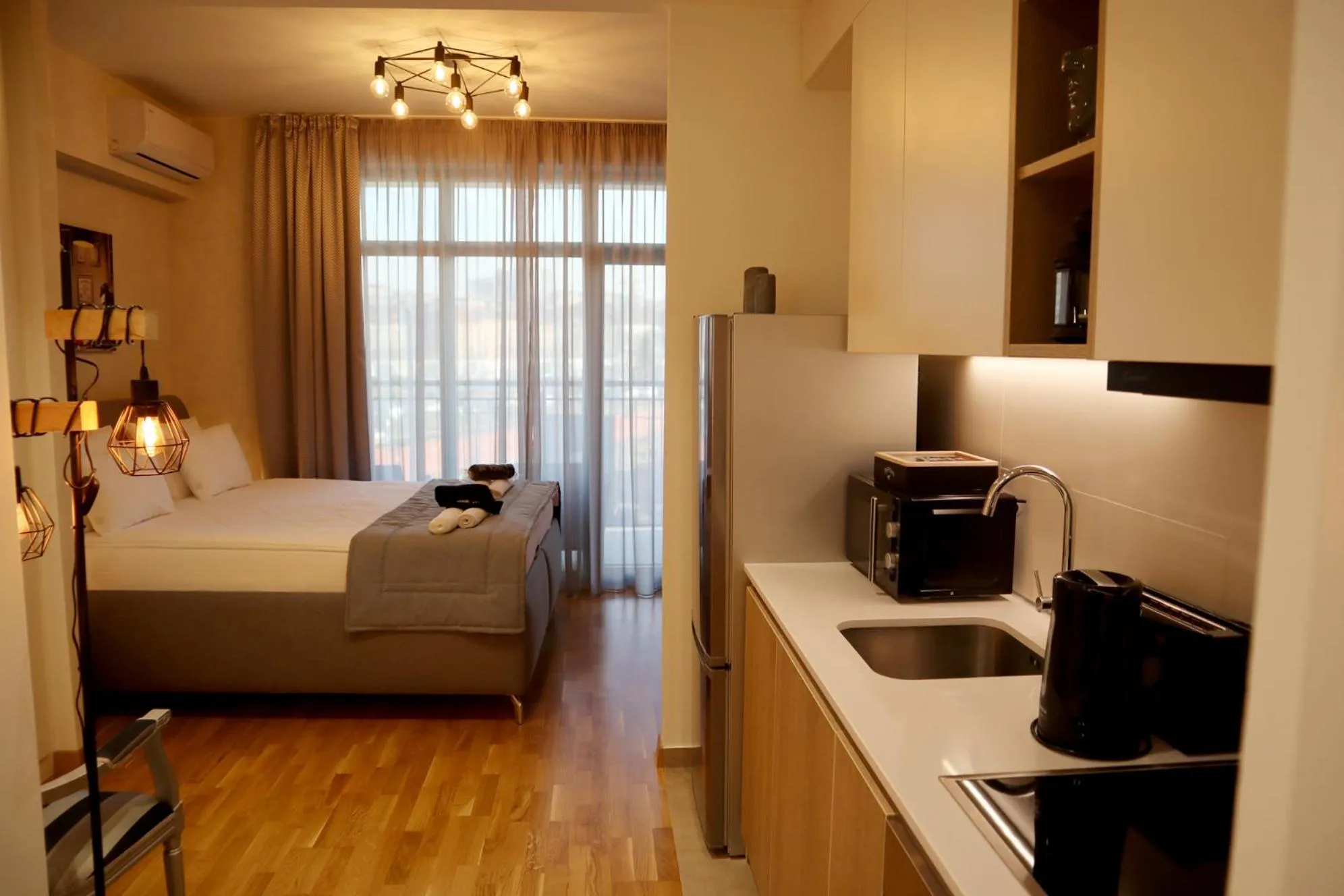 Kitchen or kitchenette, Bed in Apartments Royal - Belgrade Waterfront