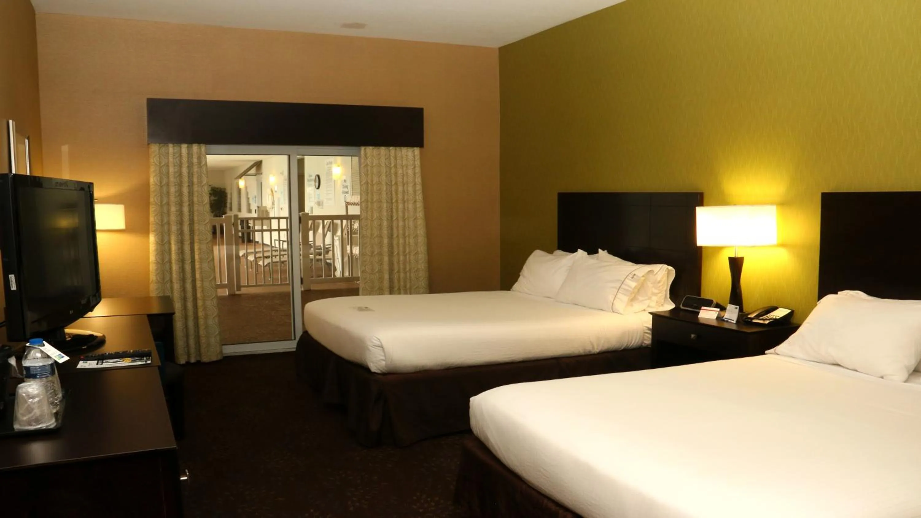 Pool view, Bed in Holiday Inn Express Hotel & Suites Saginaw by IHG