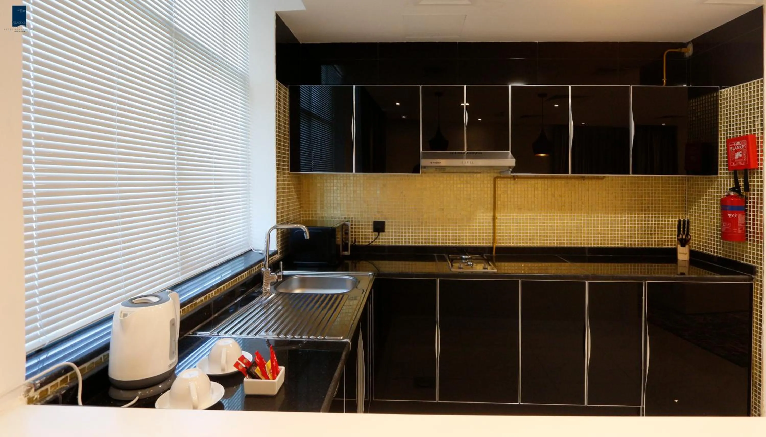 Kitchen or kitchenette in Samaya Hotel Apartment Dubai