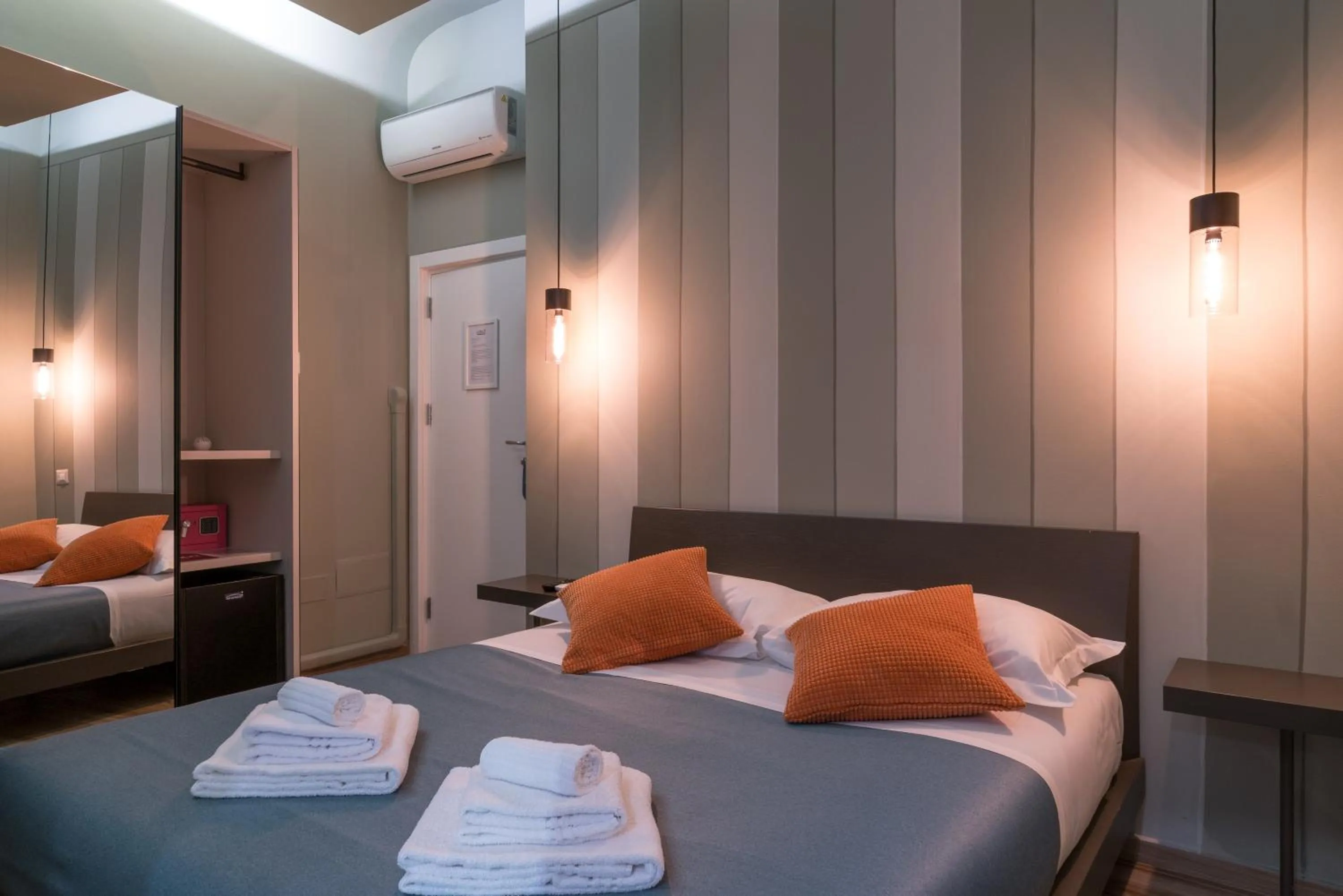 Bed in GOGO` Petit Hotel