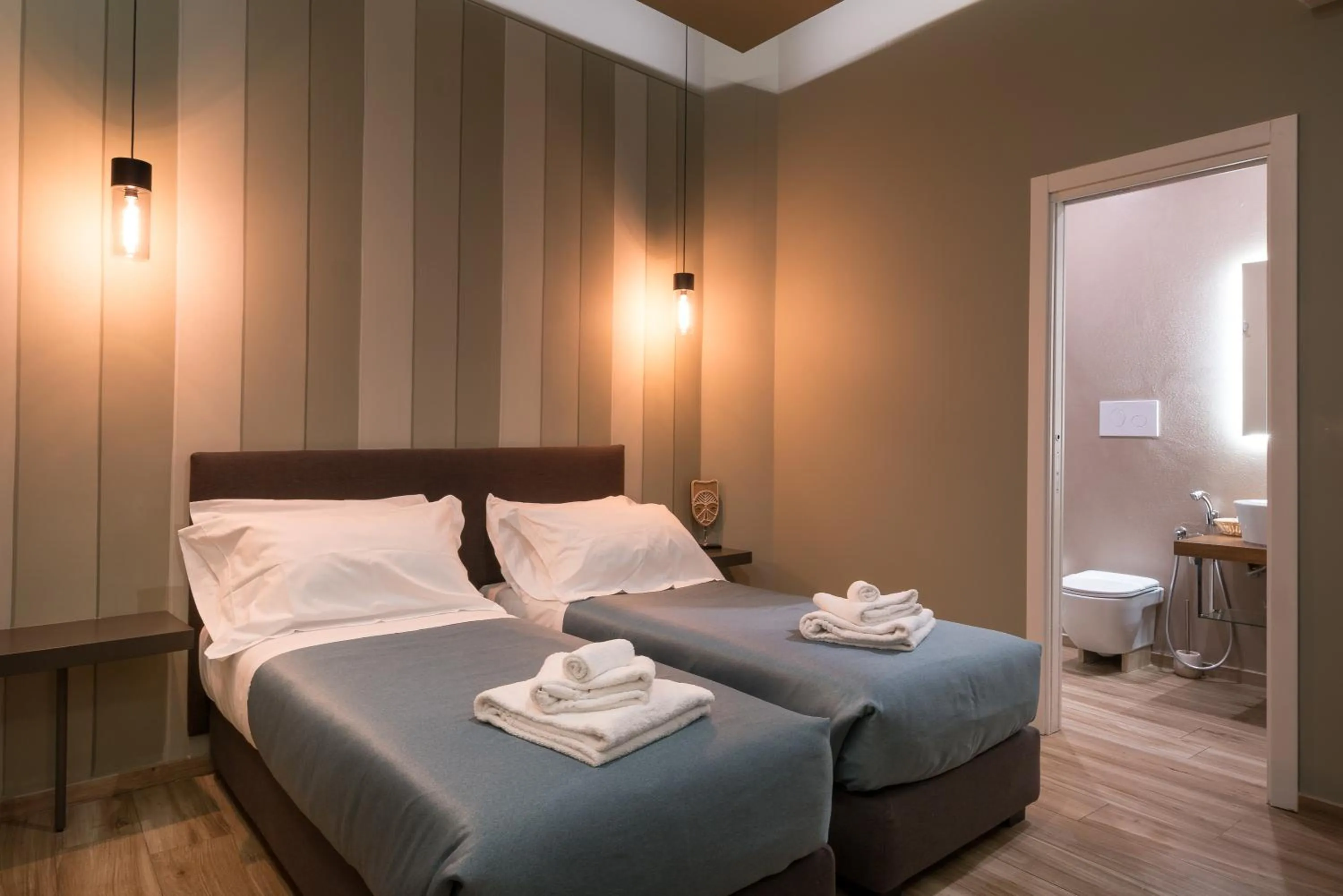 Bed in GOGO` Petit Hotel