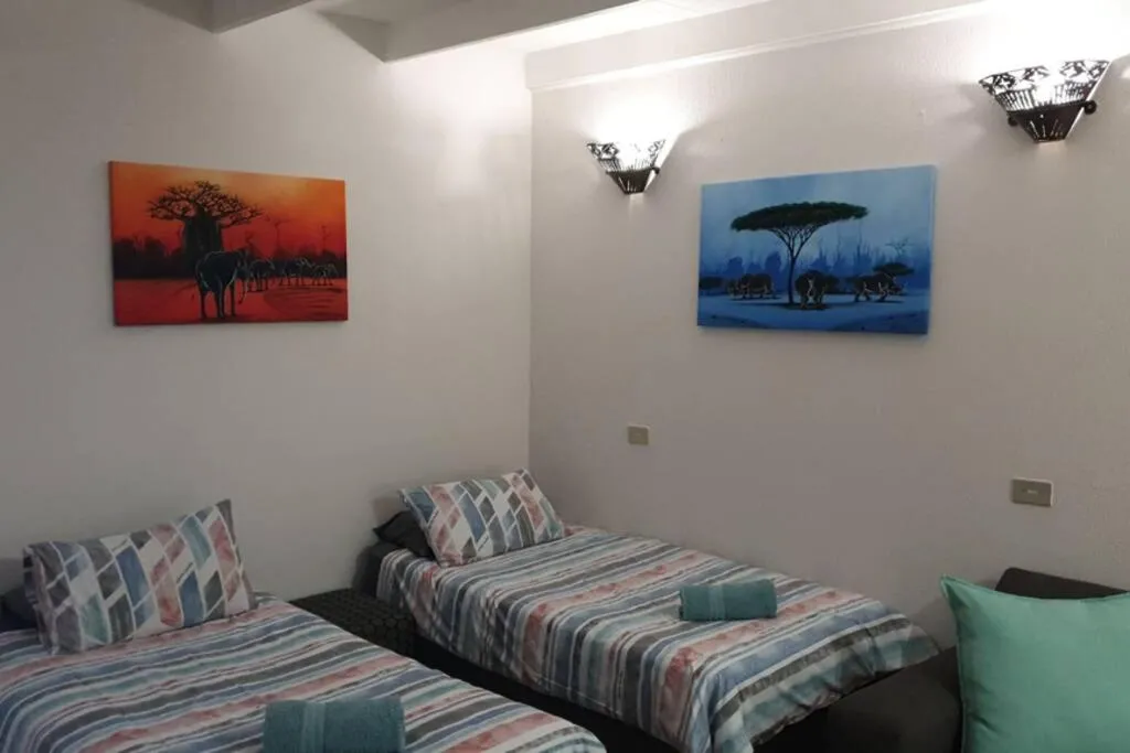 Bed in 23 Manzini Chalets-Pumba's Den