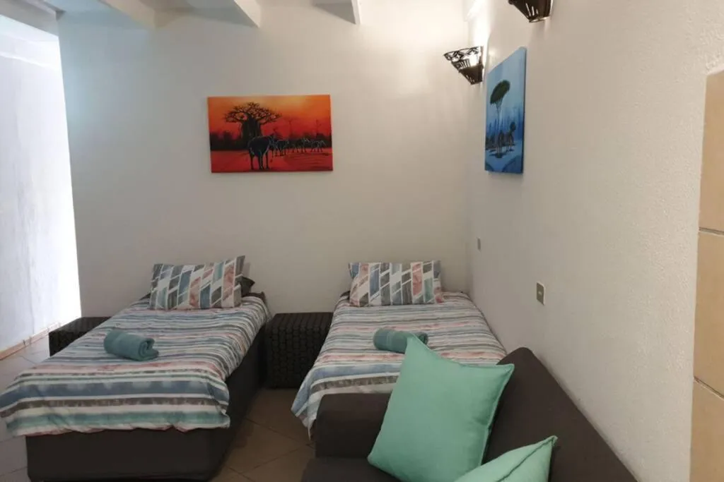 Bed in 23 Manzini Chalets-Pumba's Den