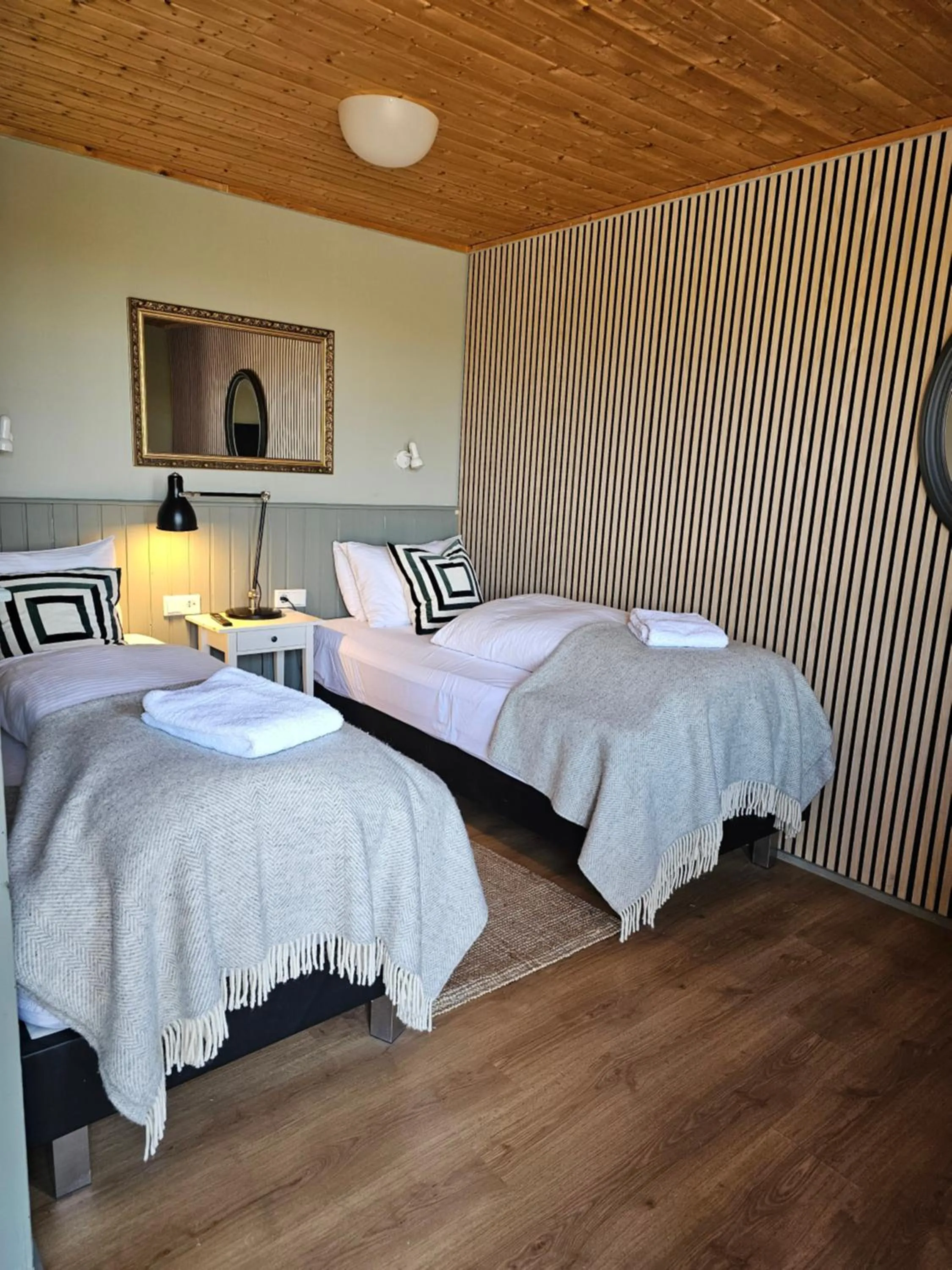 Bed in Riverfront Lodge Hella