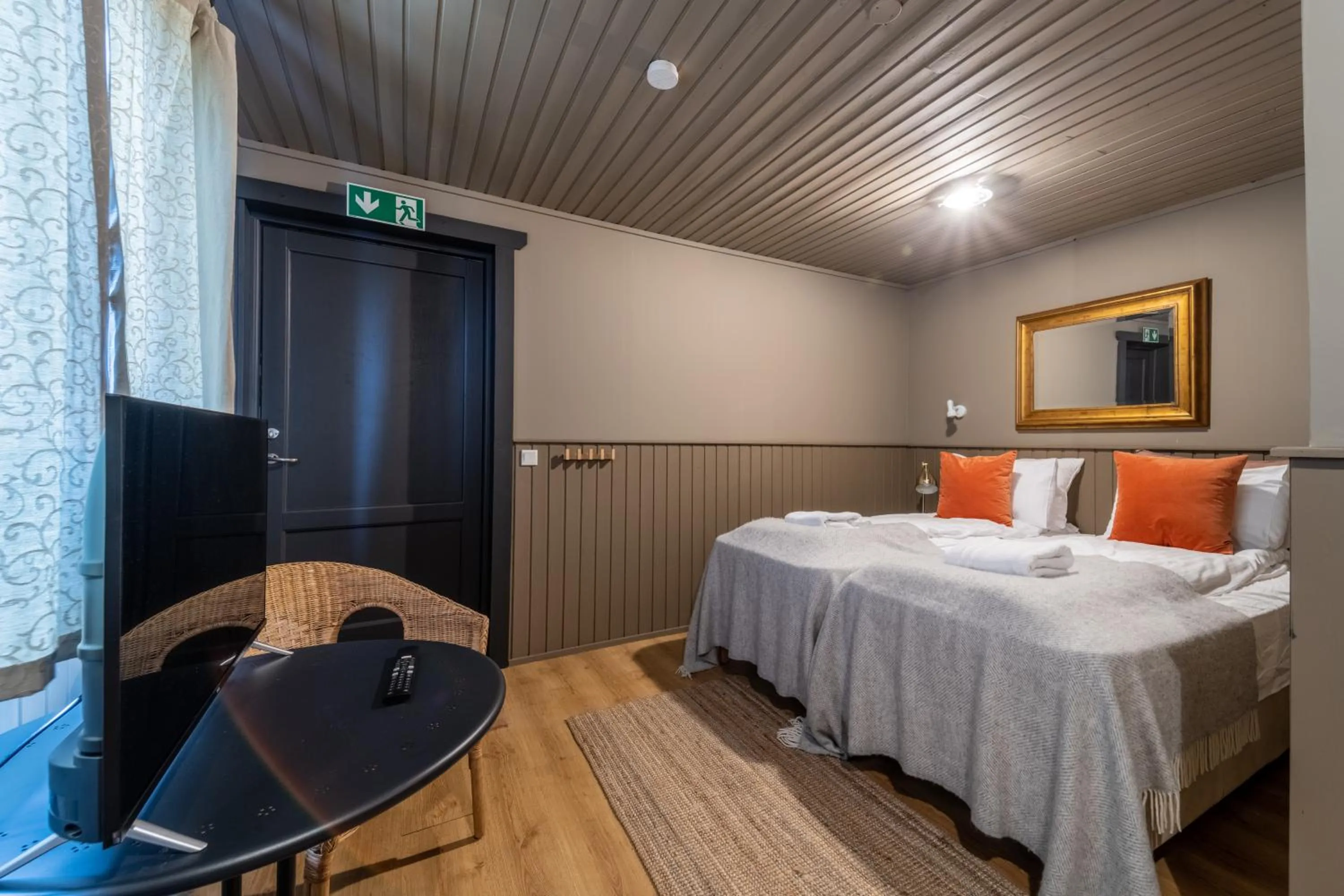 Bed in Riverfront Lodge Hella