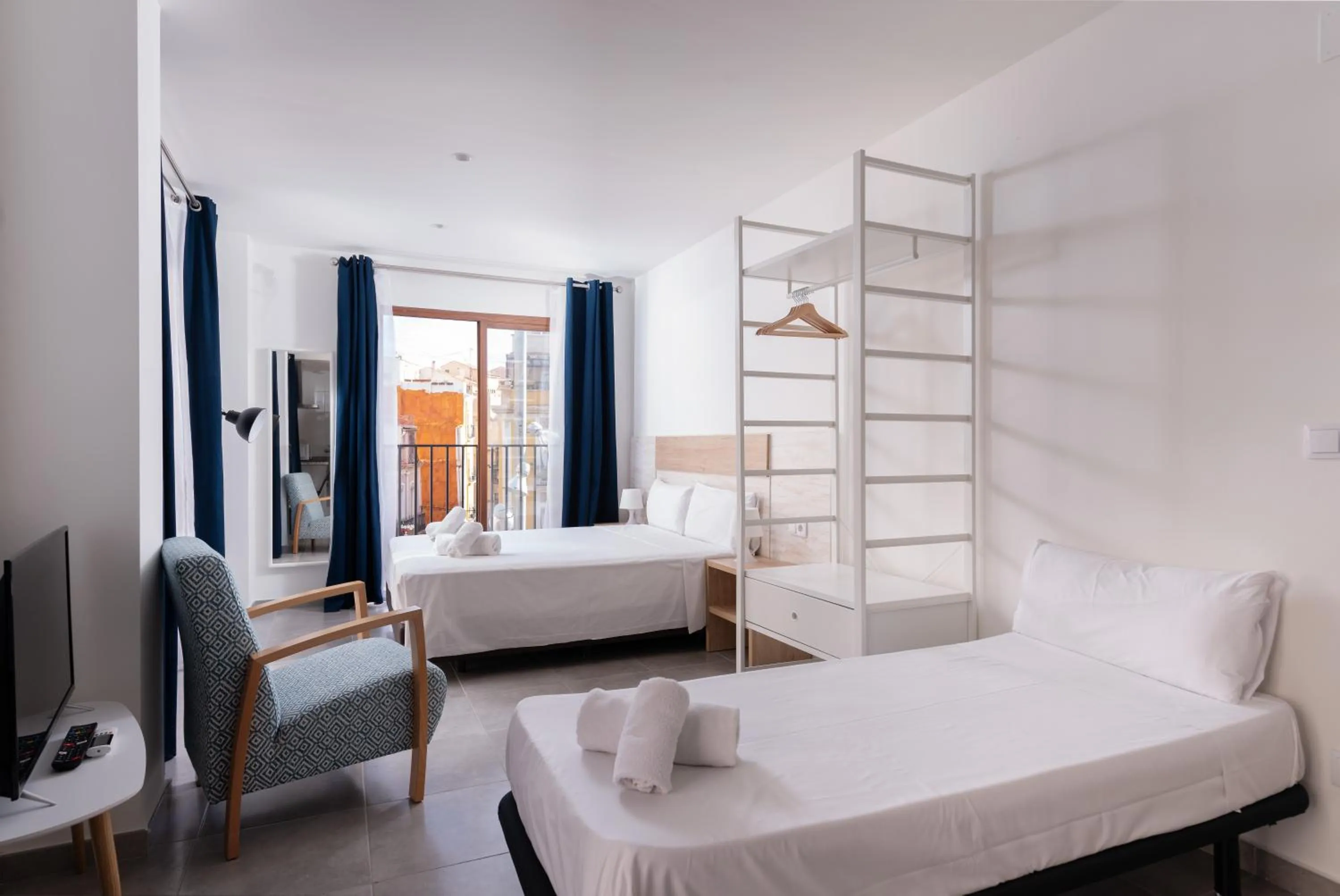 Bed in Apartamentos Quijano by Be Alicante