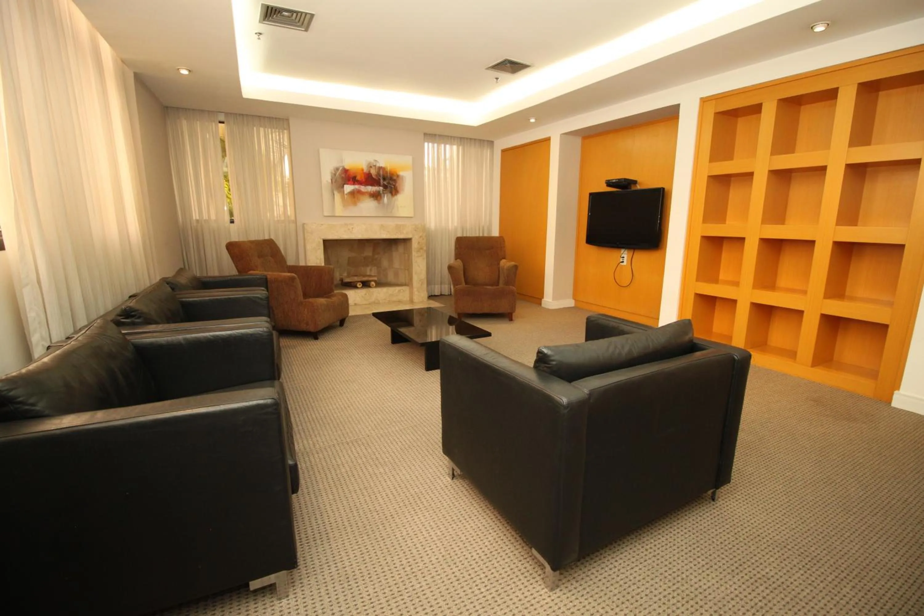 Communal lounge/ TV room in Três de Julho Flats - Jardins