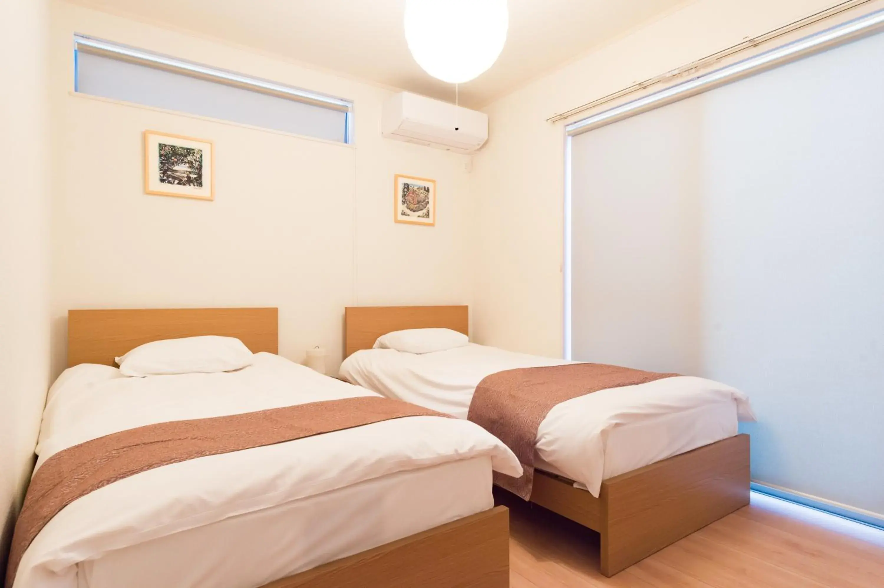 Bed in Riverside Yofuke AFP Villa Bed in Riverside Yofuke AFP Villa