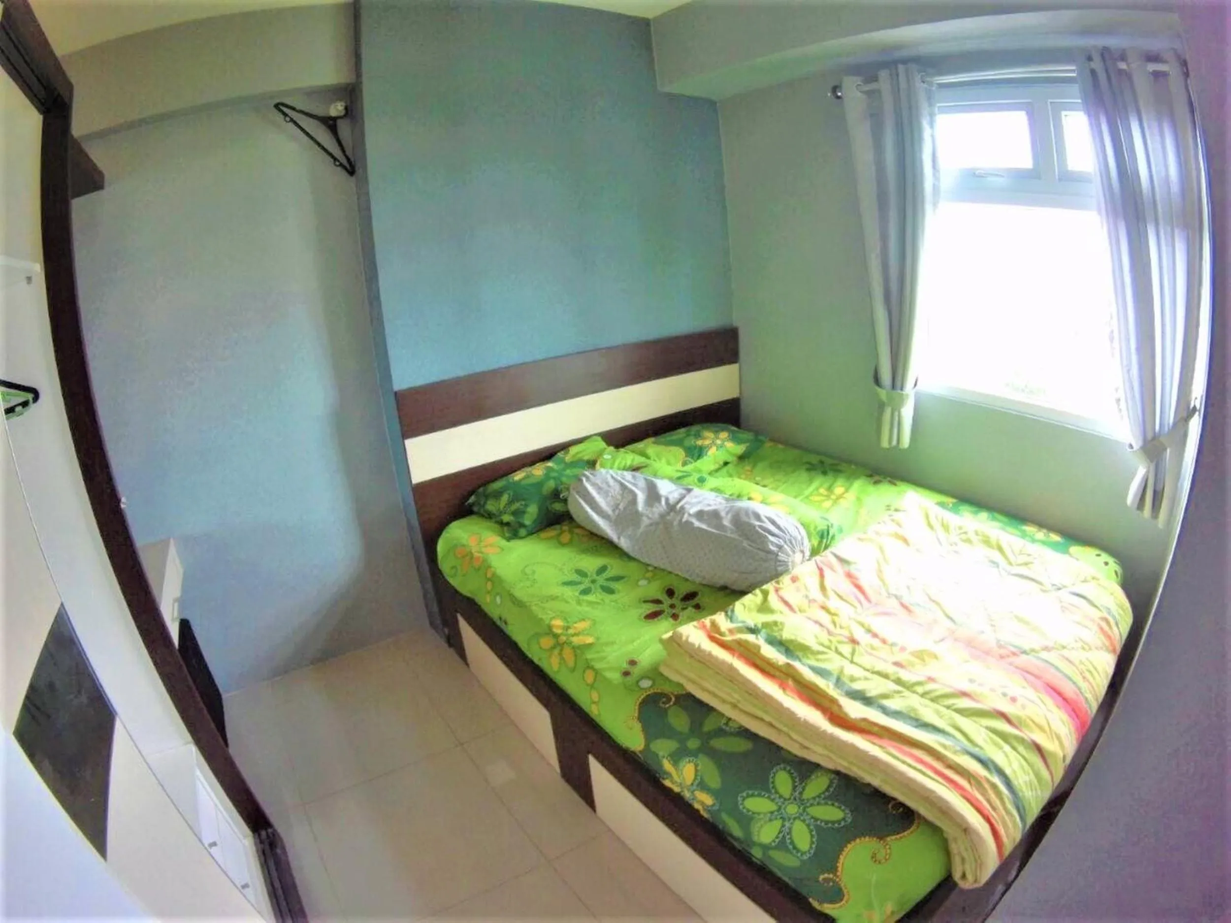 Bed in Green Pramuka Apartement By Vici