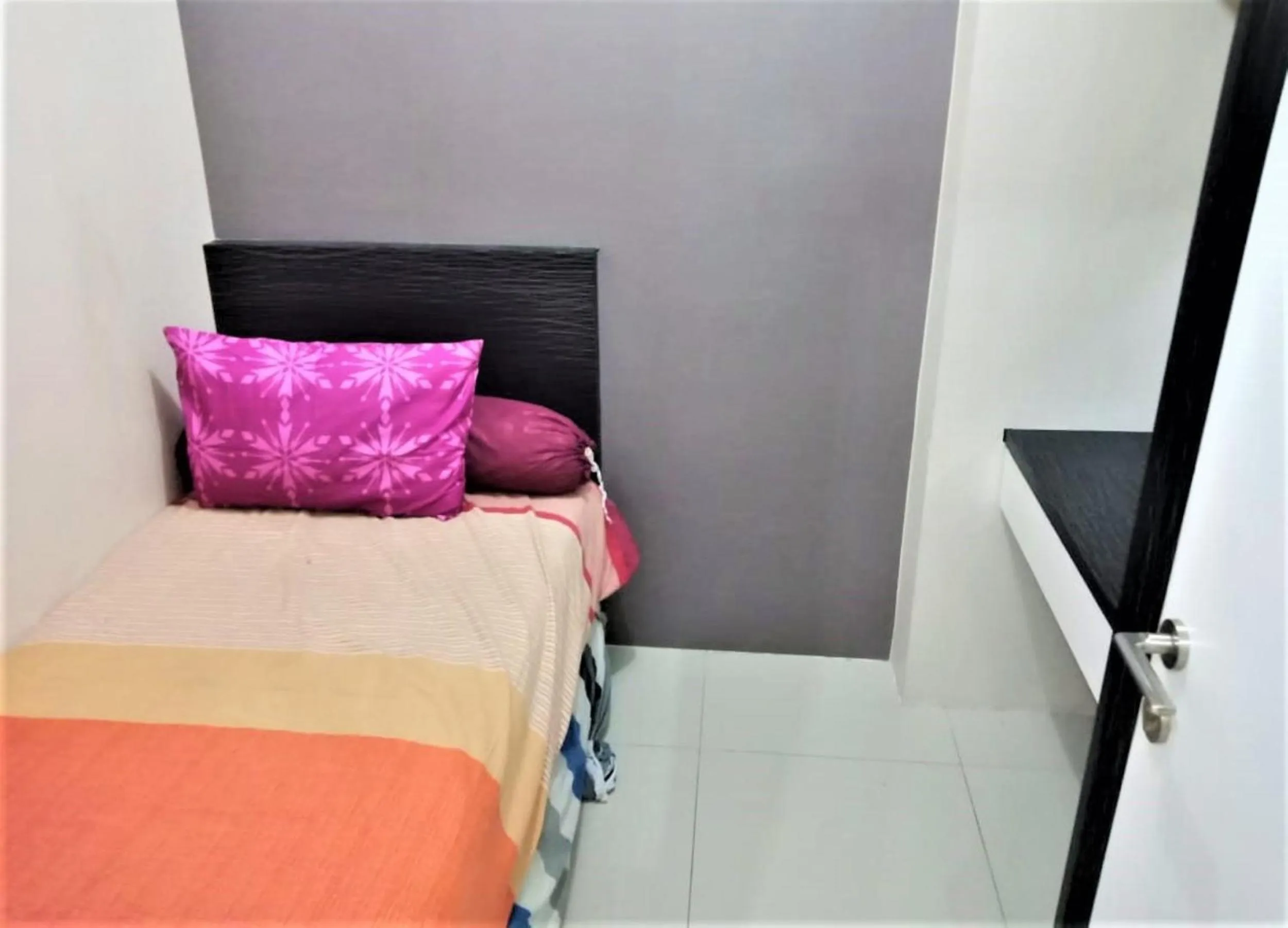 Bed in Green Pramuka Apartement By Vici