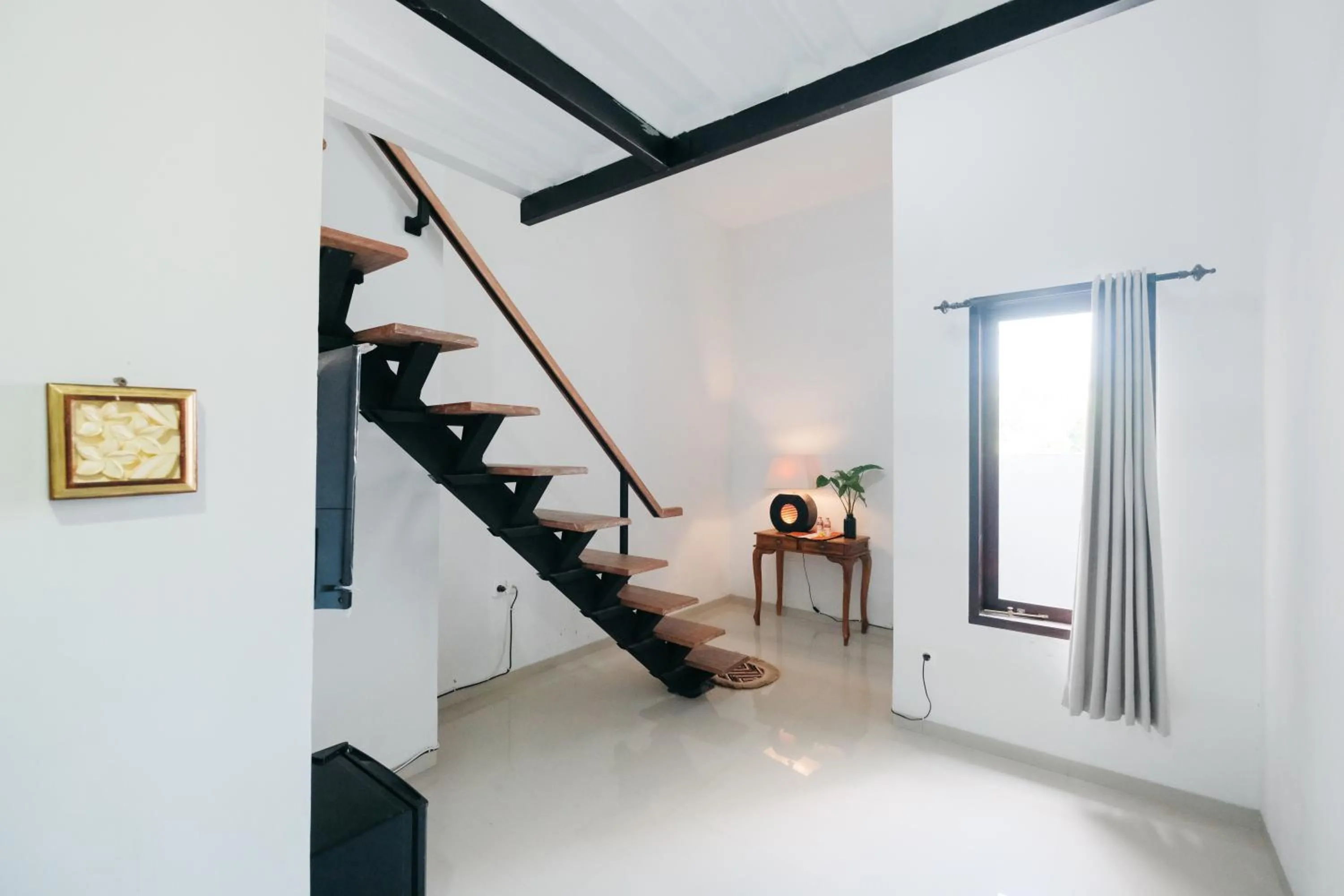 Living room in D' Tamblingan Guesthouse Jimbaran RedPartner