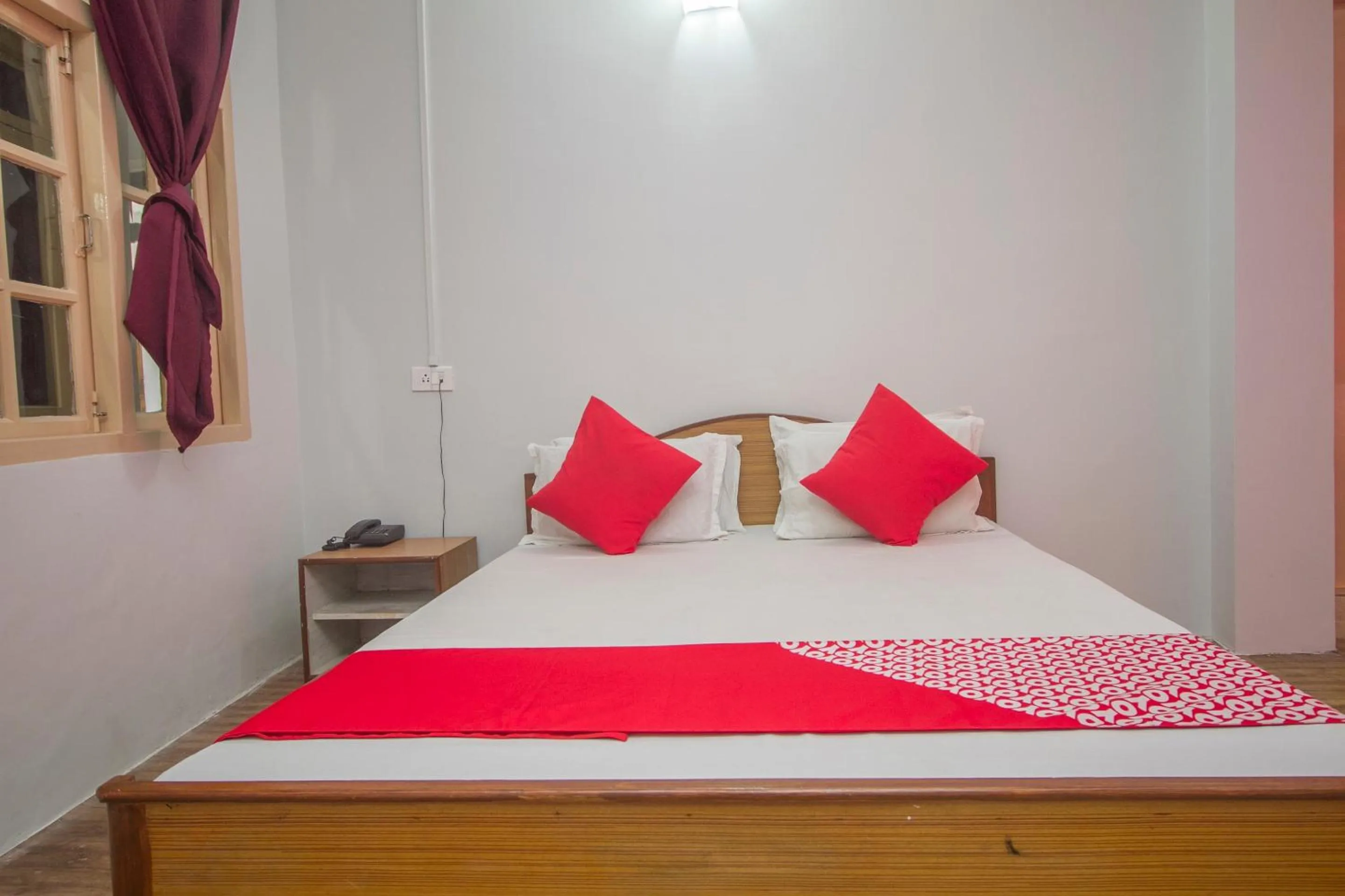 Bedroom in Hotel O Nourpem Residency