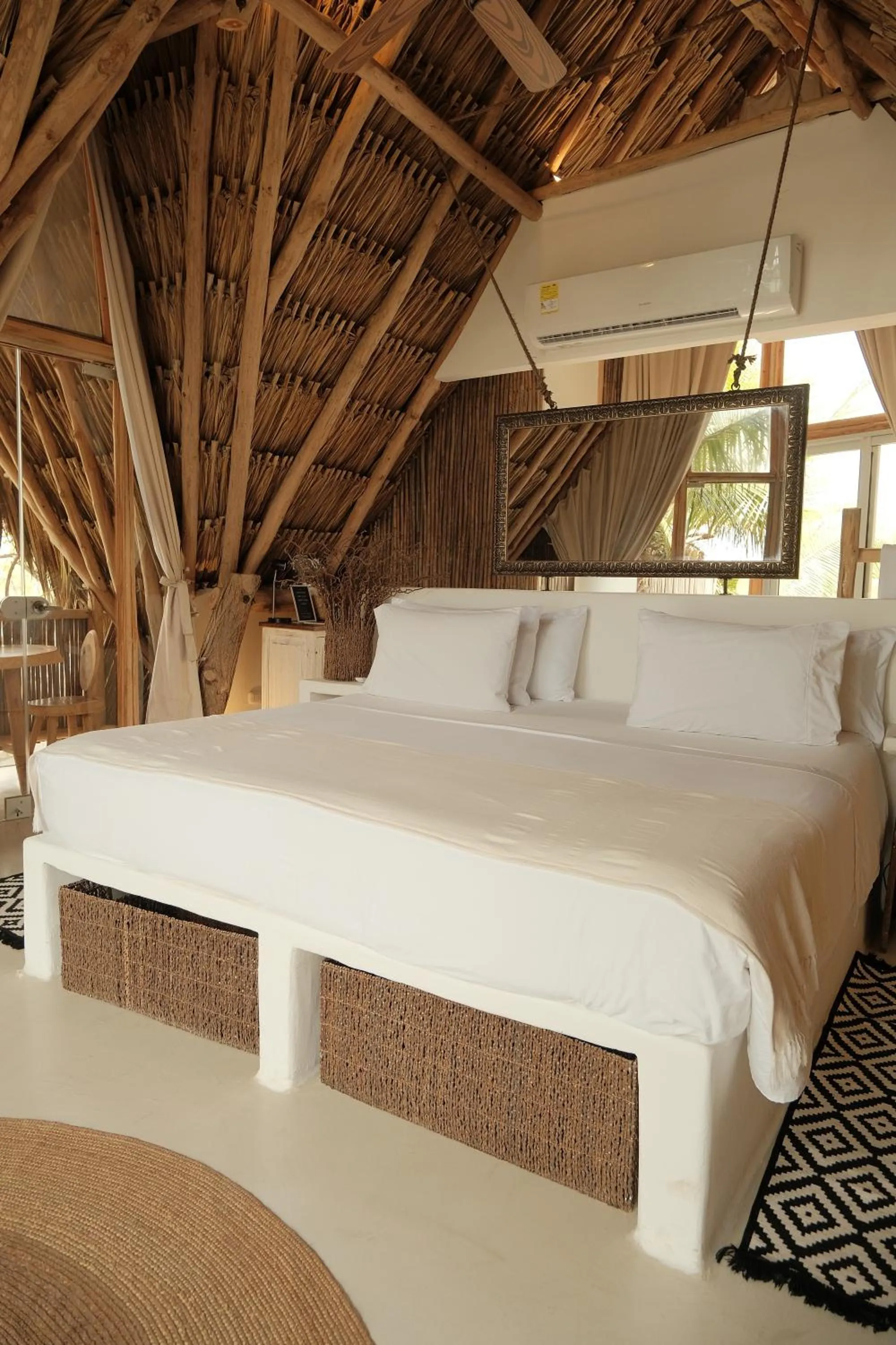 Bed in Éteka Slow Beach Hotel Adults Only