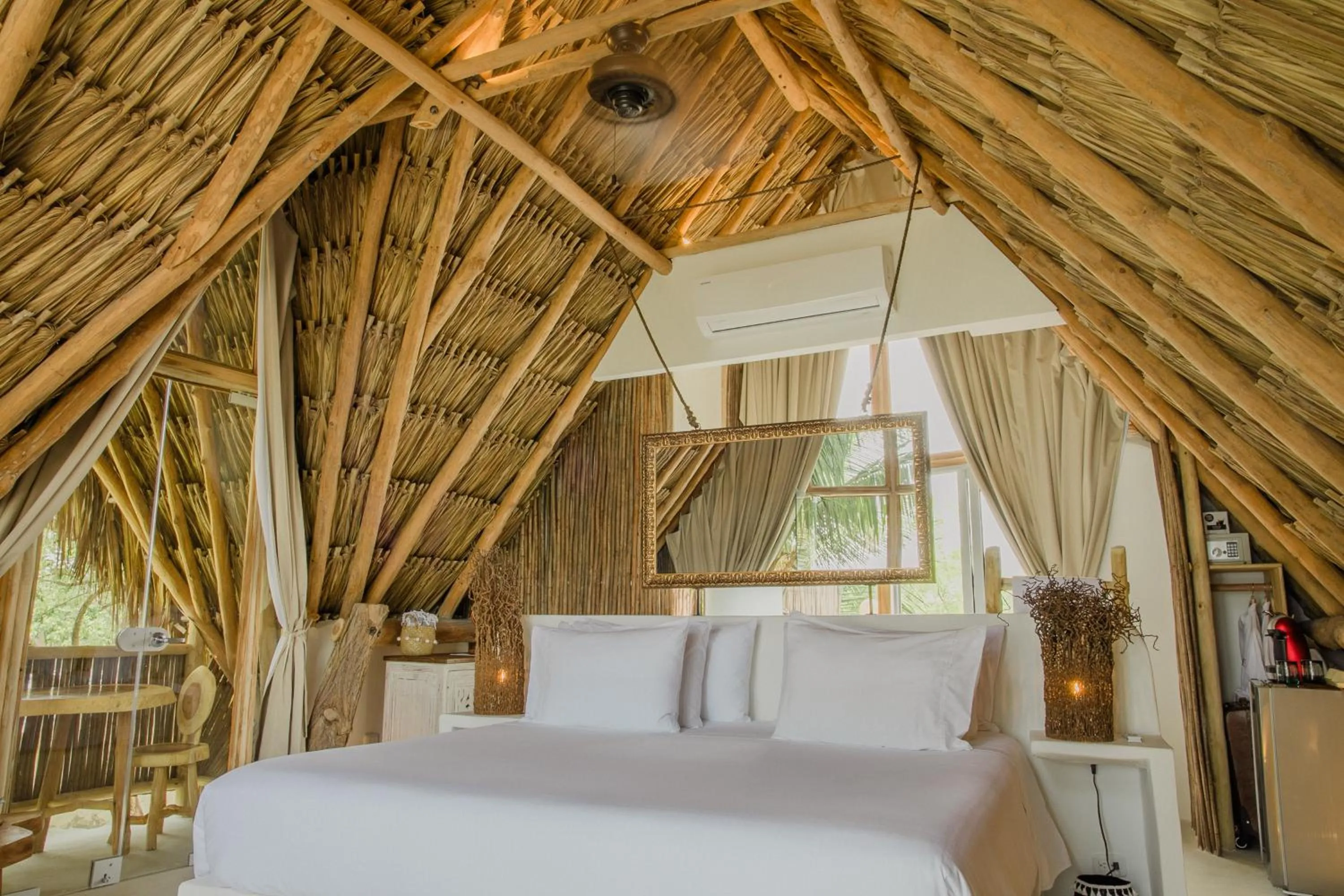 Bed in Éteka Slow Beach Hotel Adults Only