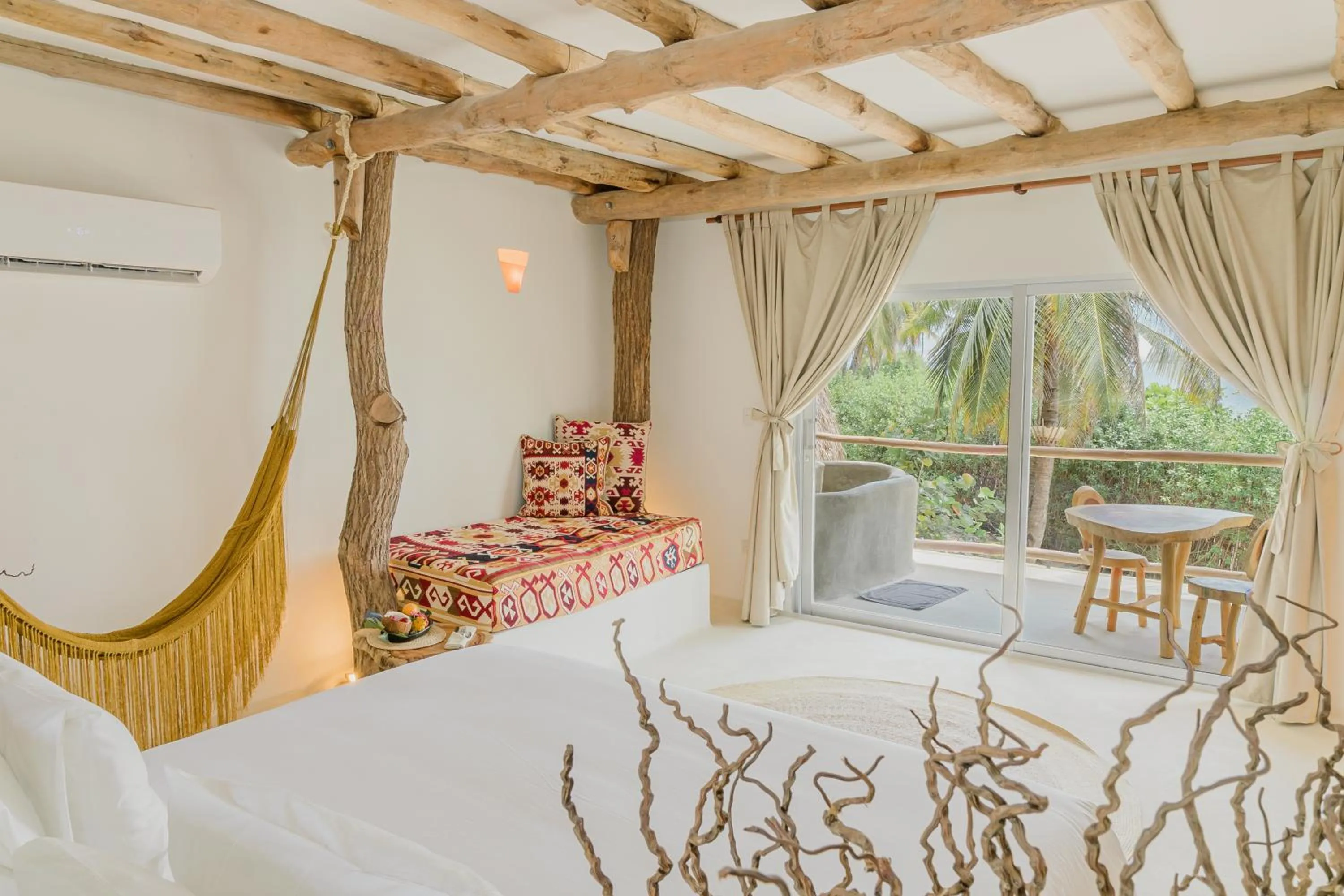 Bed in Éteka Slow Beach Hotel Adults Only