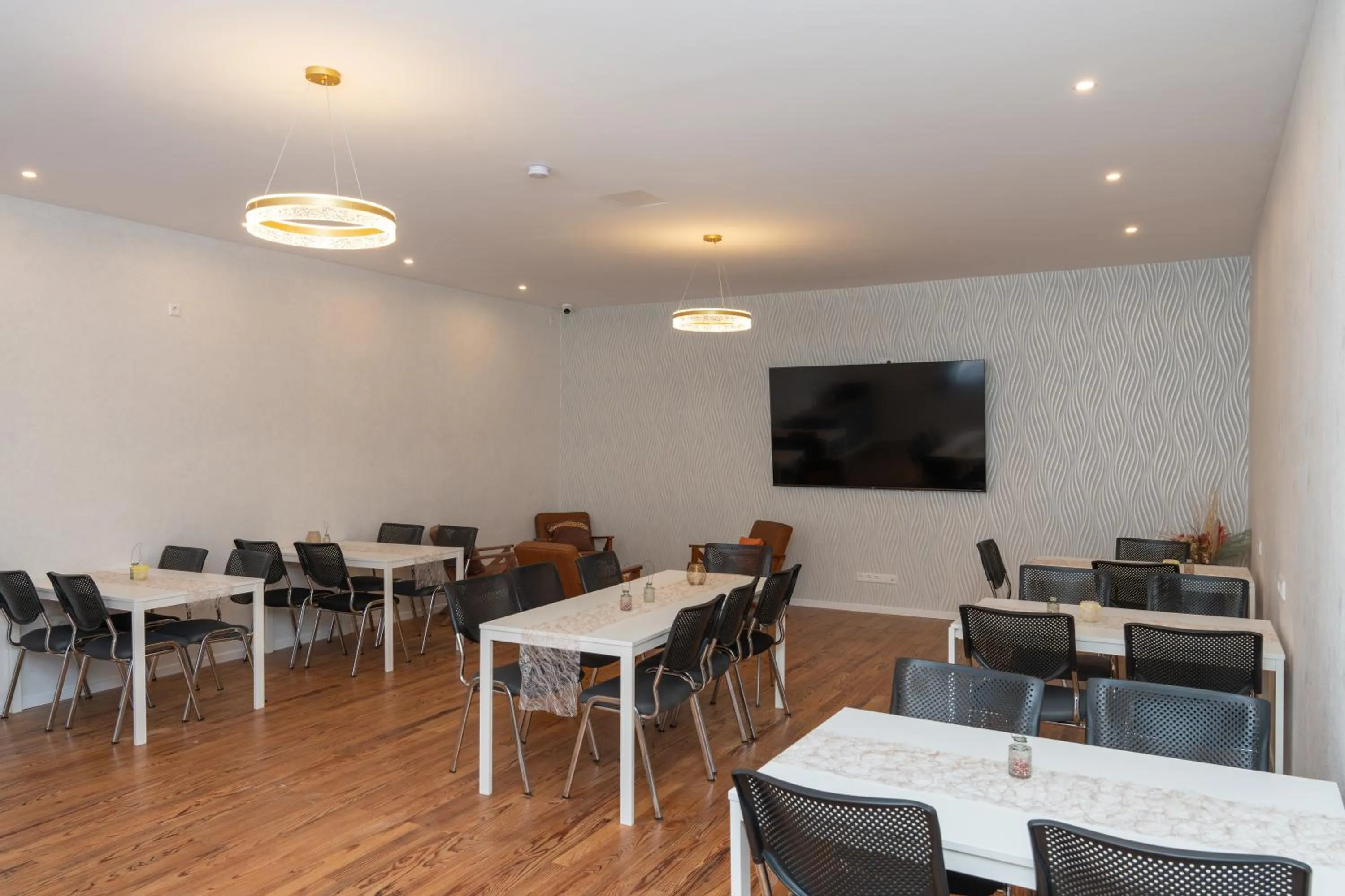 Communal lounge/ TV room in Hotel Phoenix