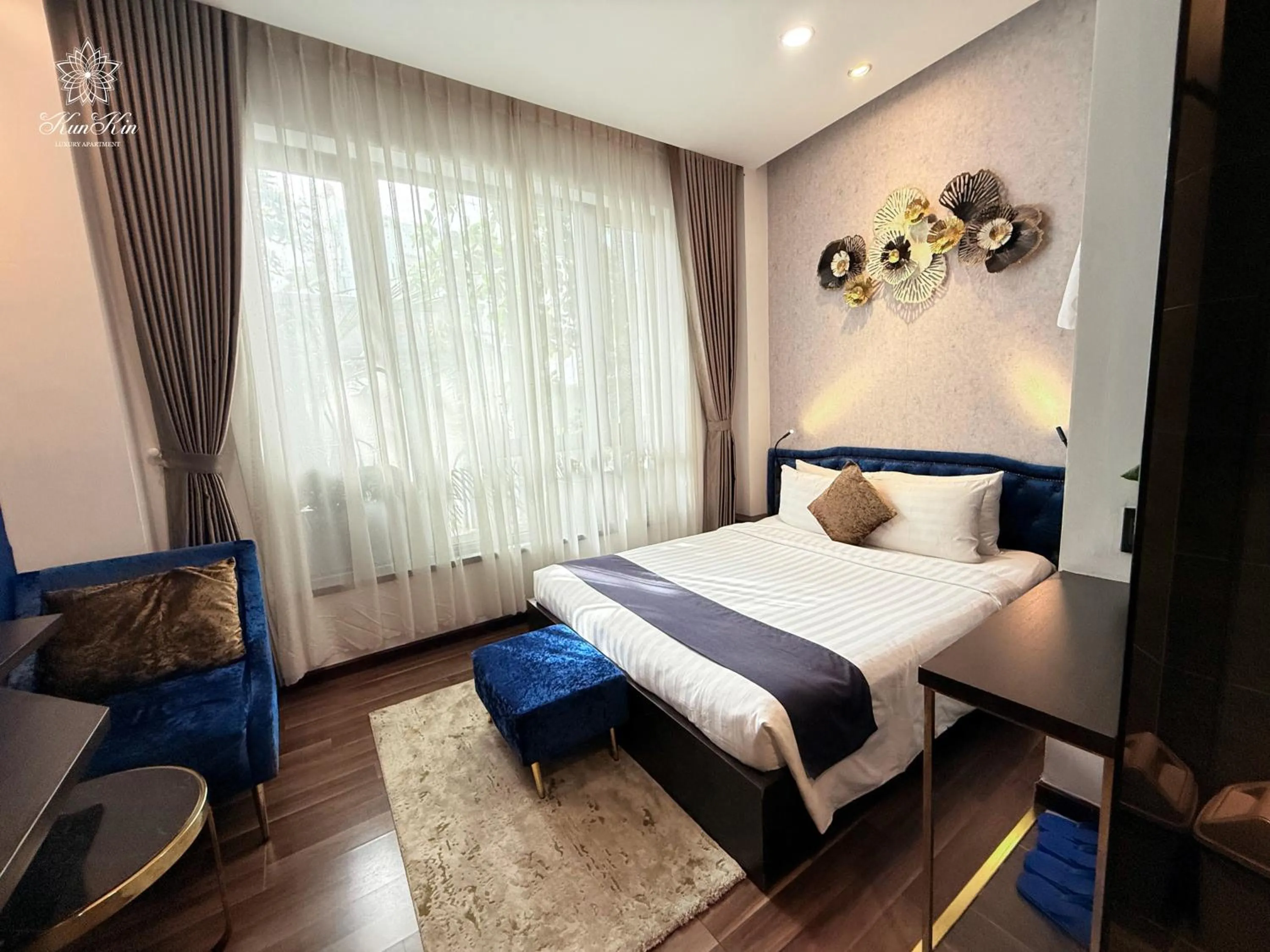 Bed in KunKin Luxury Hotel & Apartment