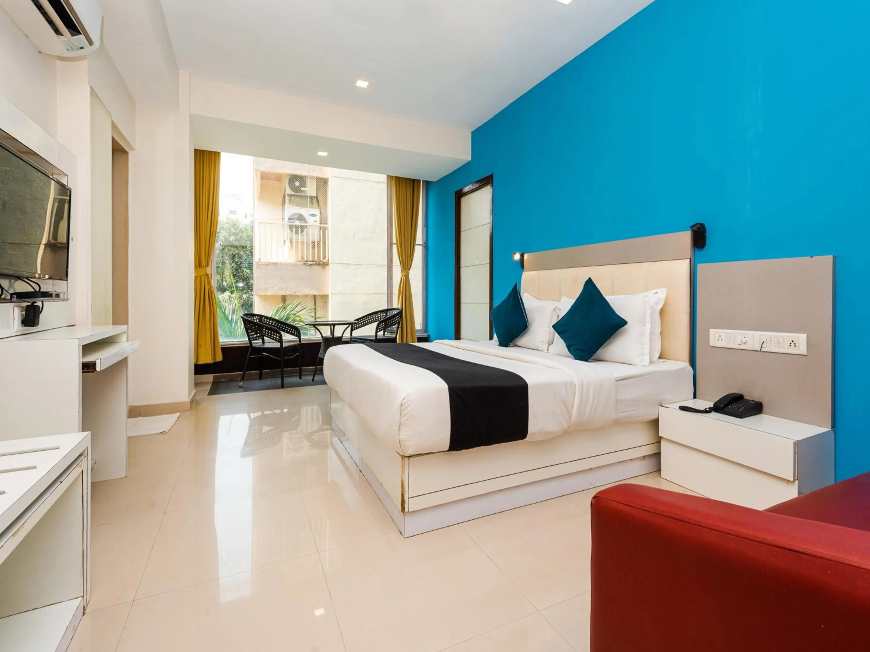 Photo of the whole room, Bed in Hotel Aura - Near Malad Link Road