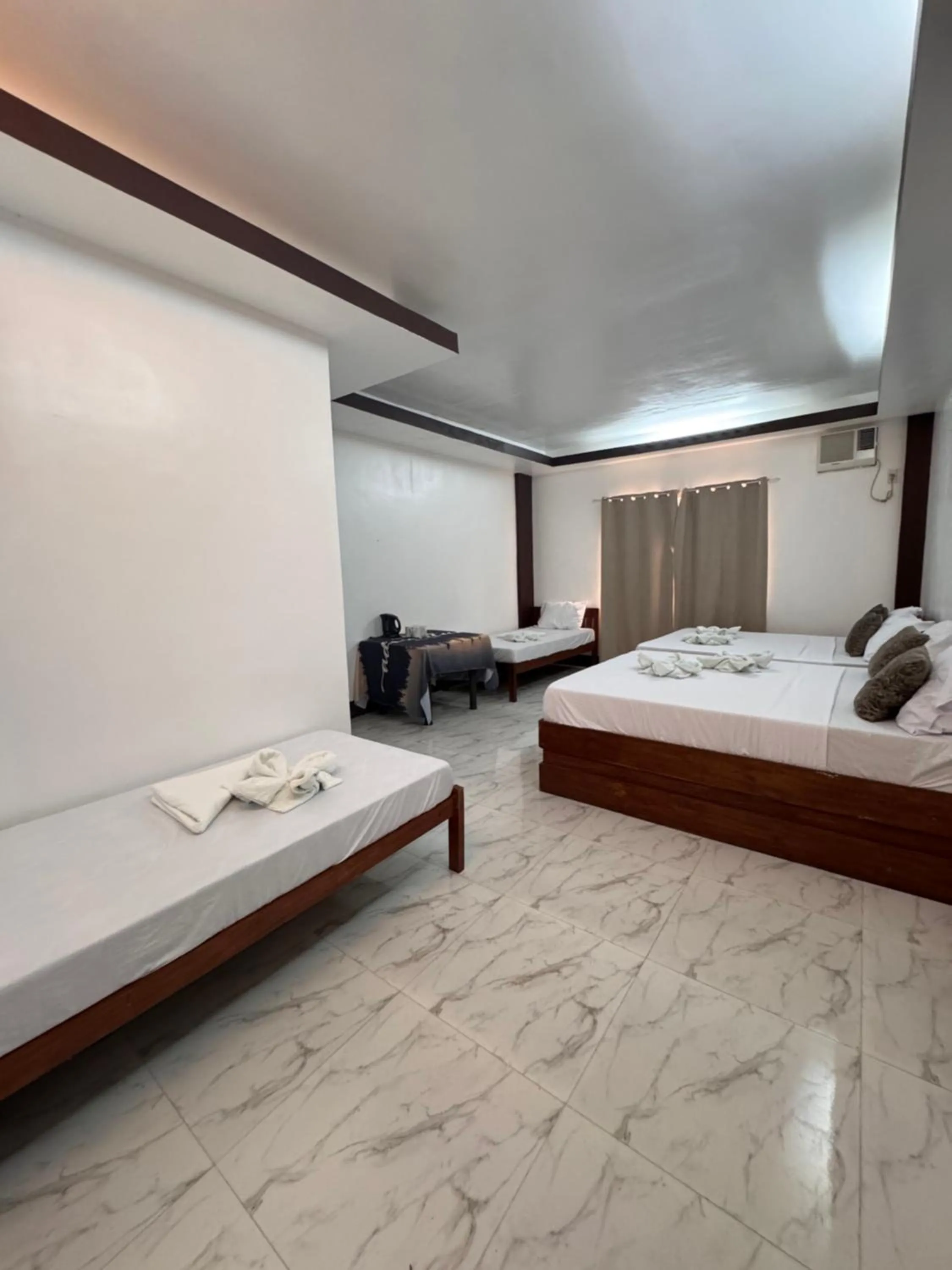 Bed in MANANQUIL TRAVEL LODGE