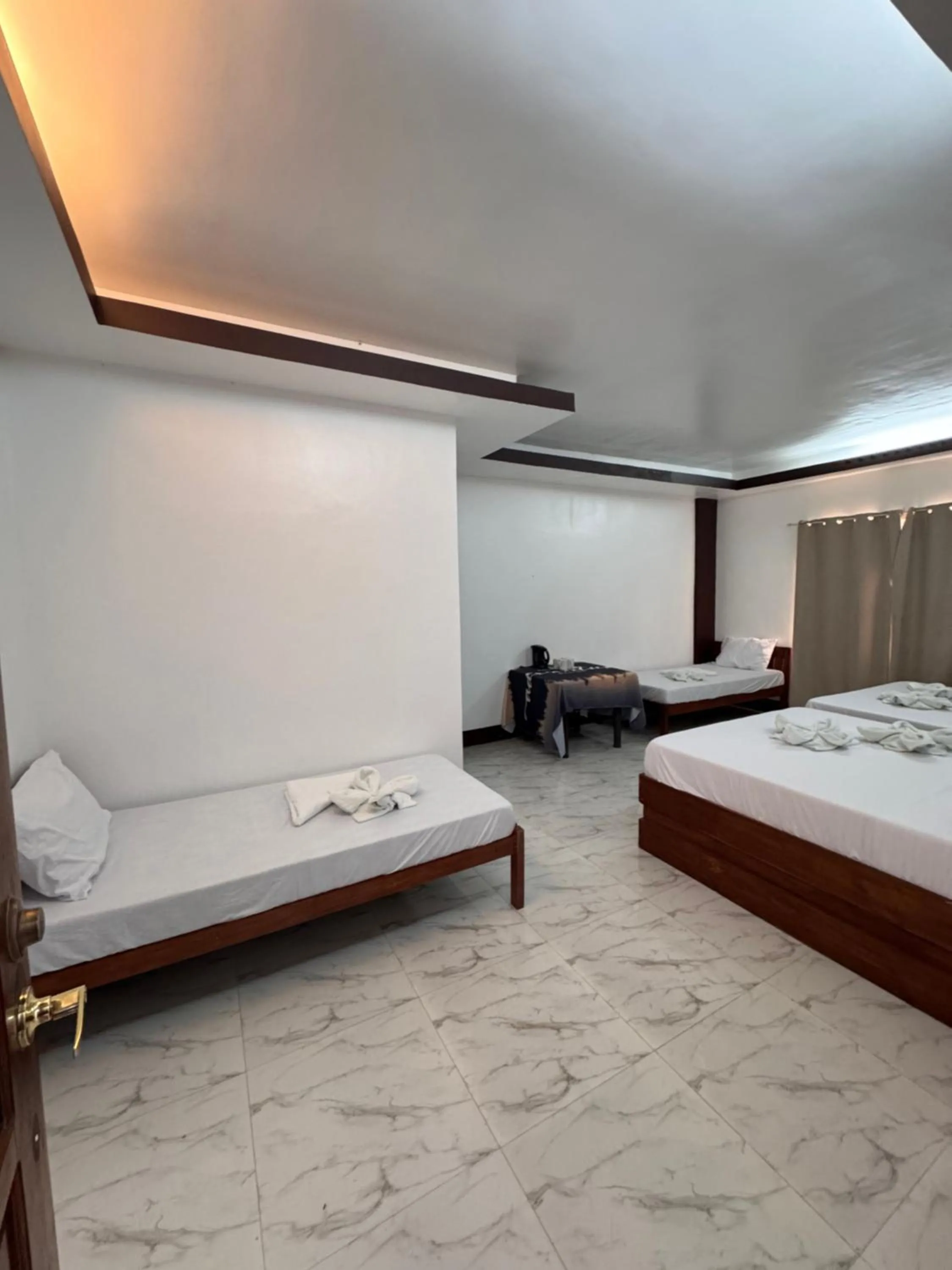 Bed in MANANQUIL TRAVEL LODGE