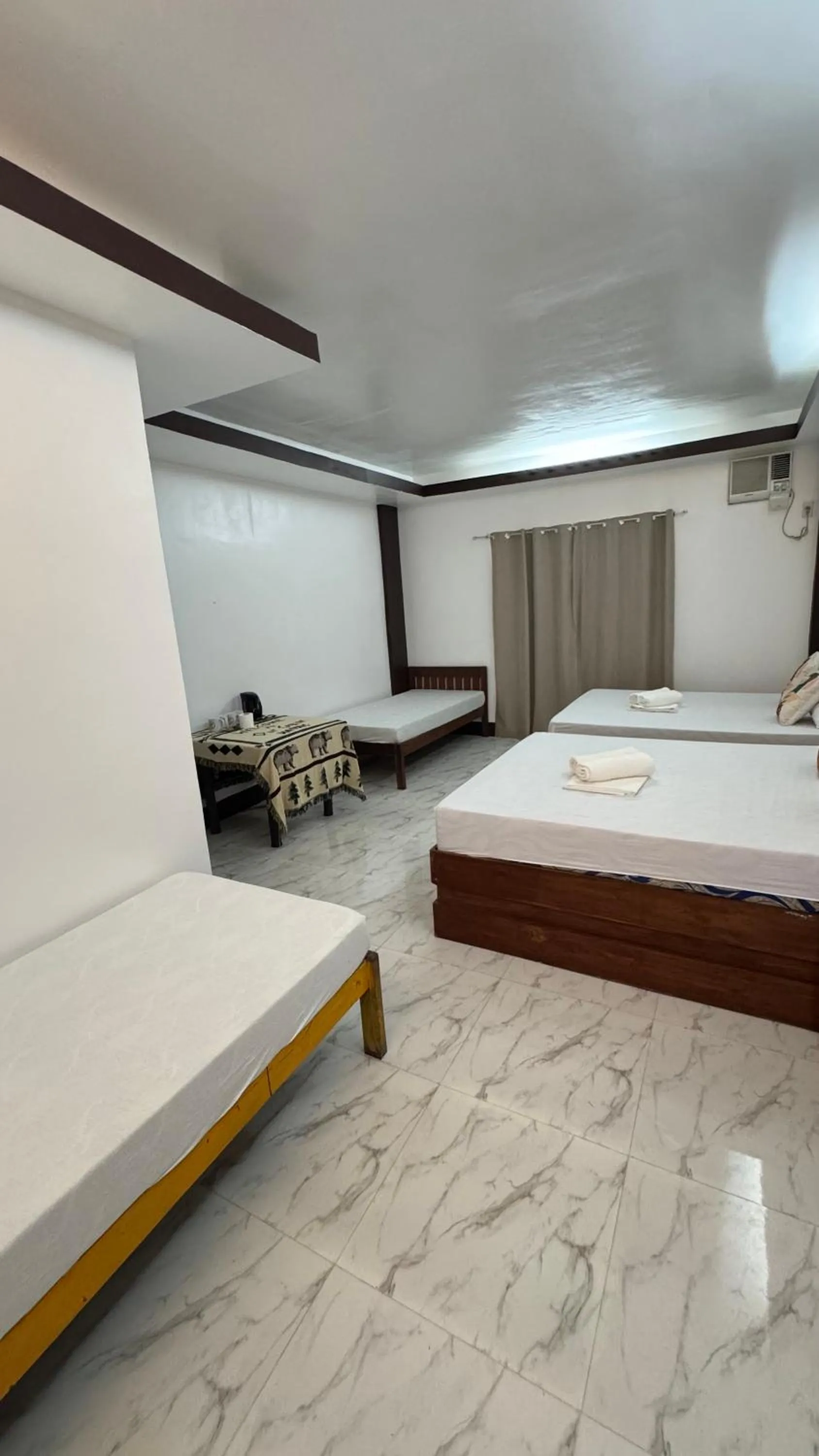 Bed in MANANQUIL TRAVEL LODGE