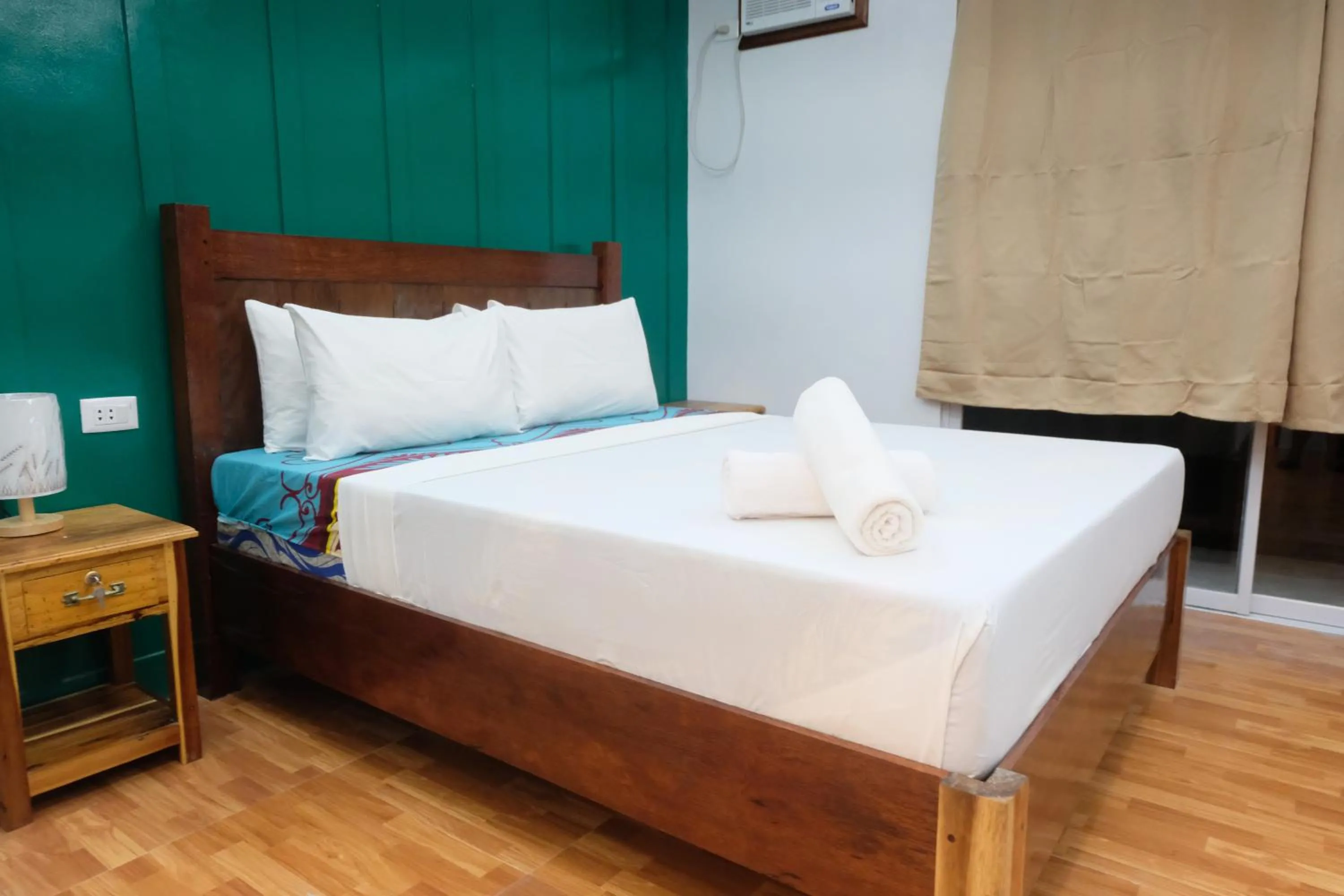 Bed in MANANQUIL TRAVEL LODGE