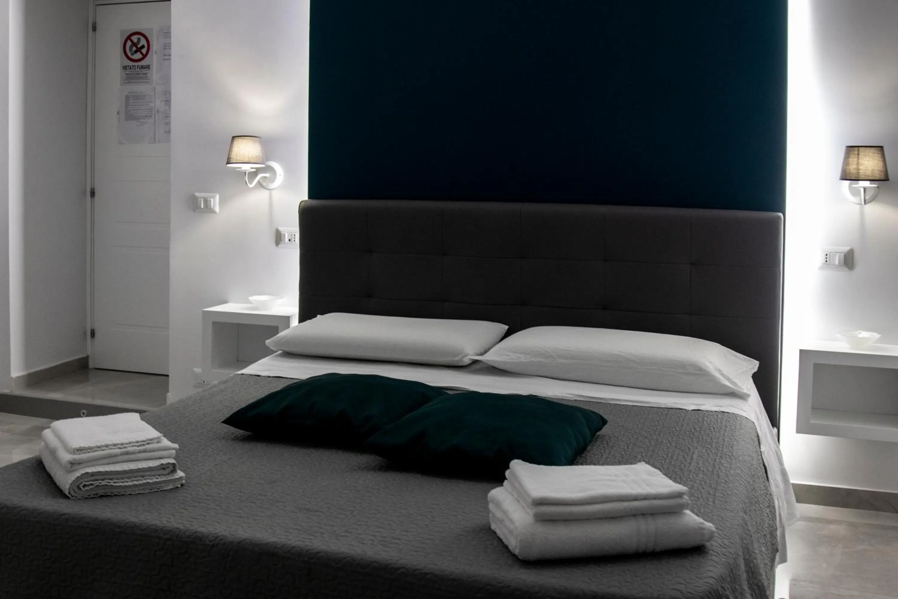 Bed in Aurora Luxury Rooms