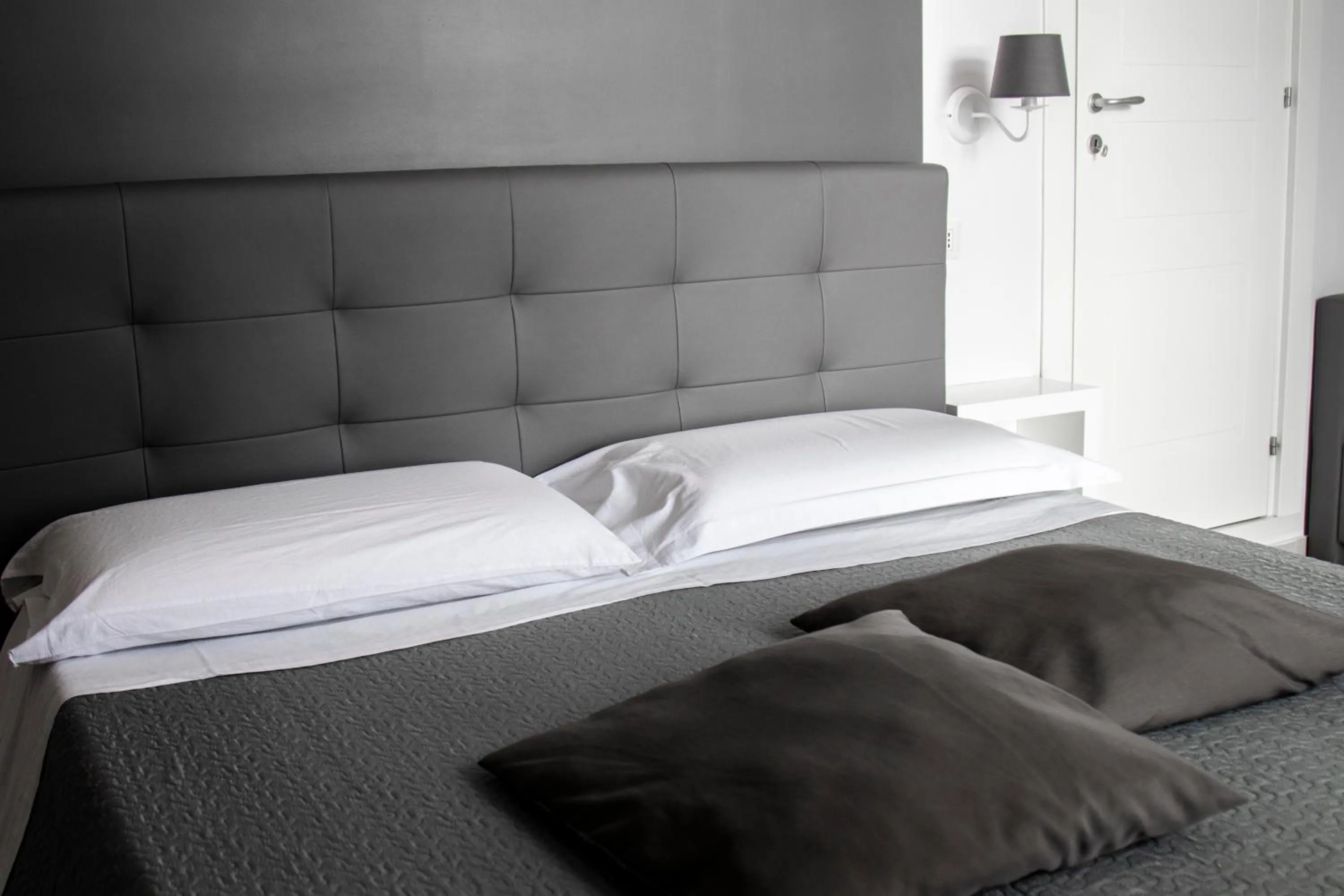 Bed in Aurora Luxury Rooms