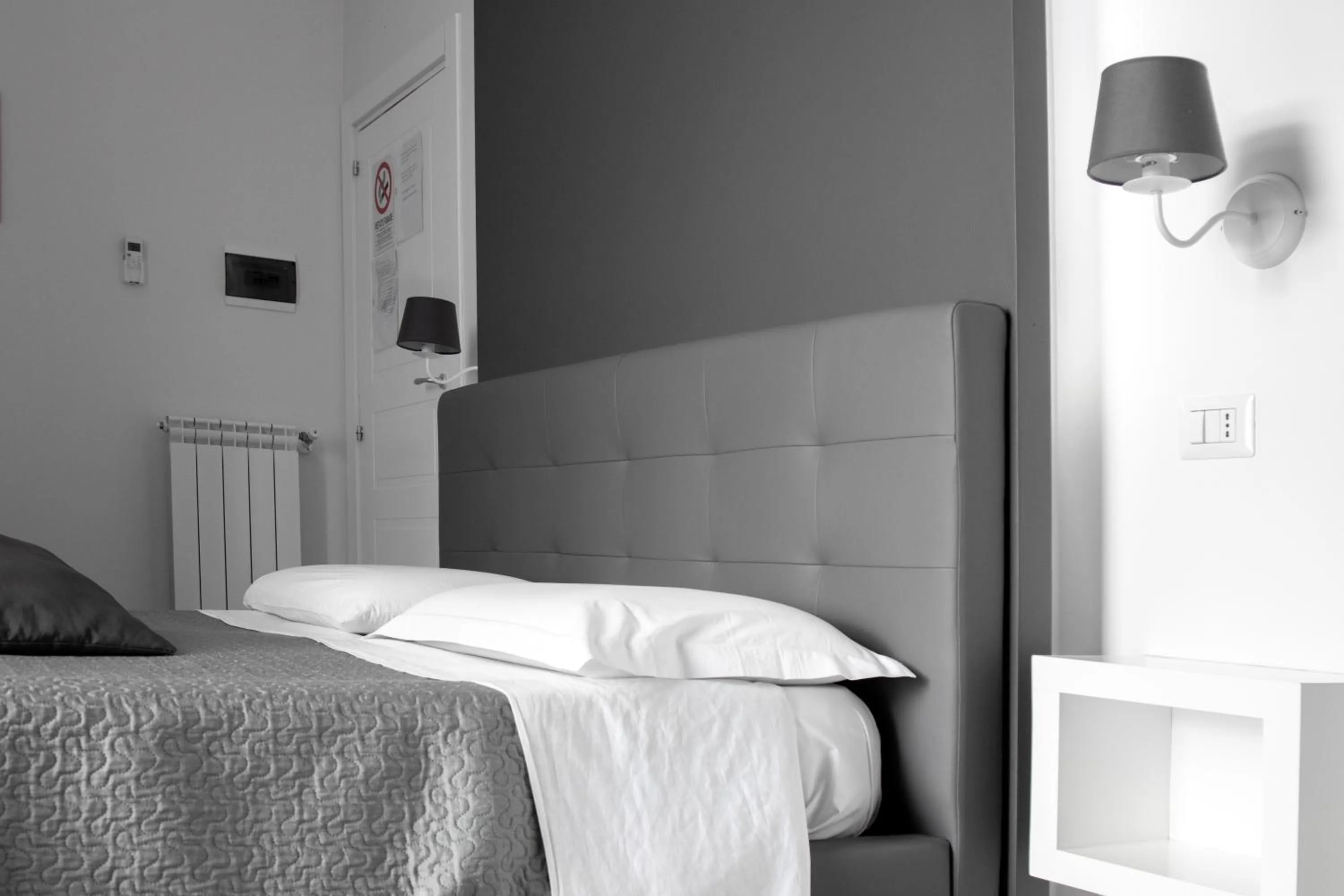 Bed in Aurora Luxury Rooms