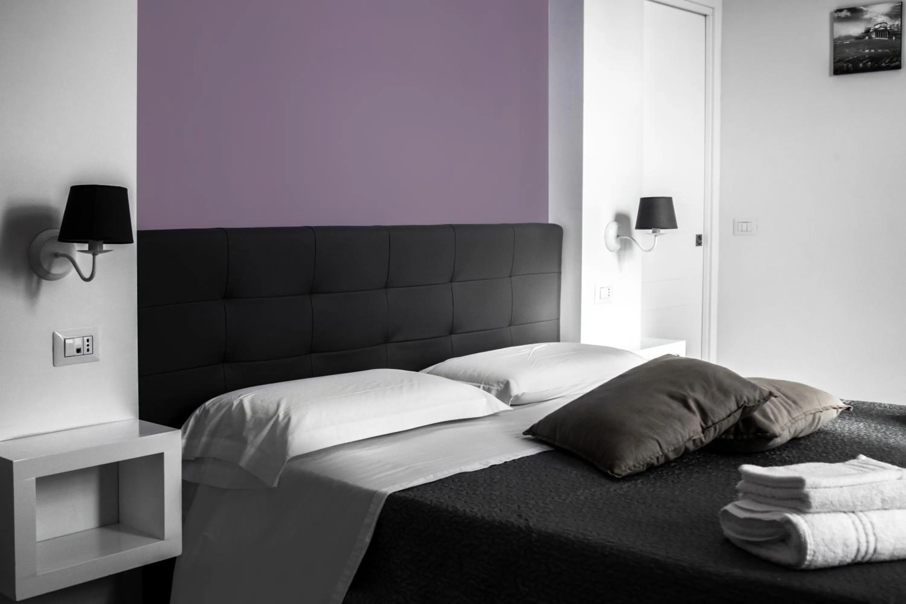 Bed in Aurora Luxury Rooms