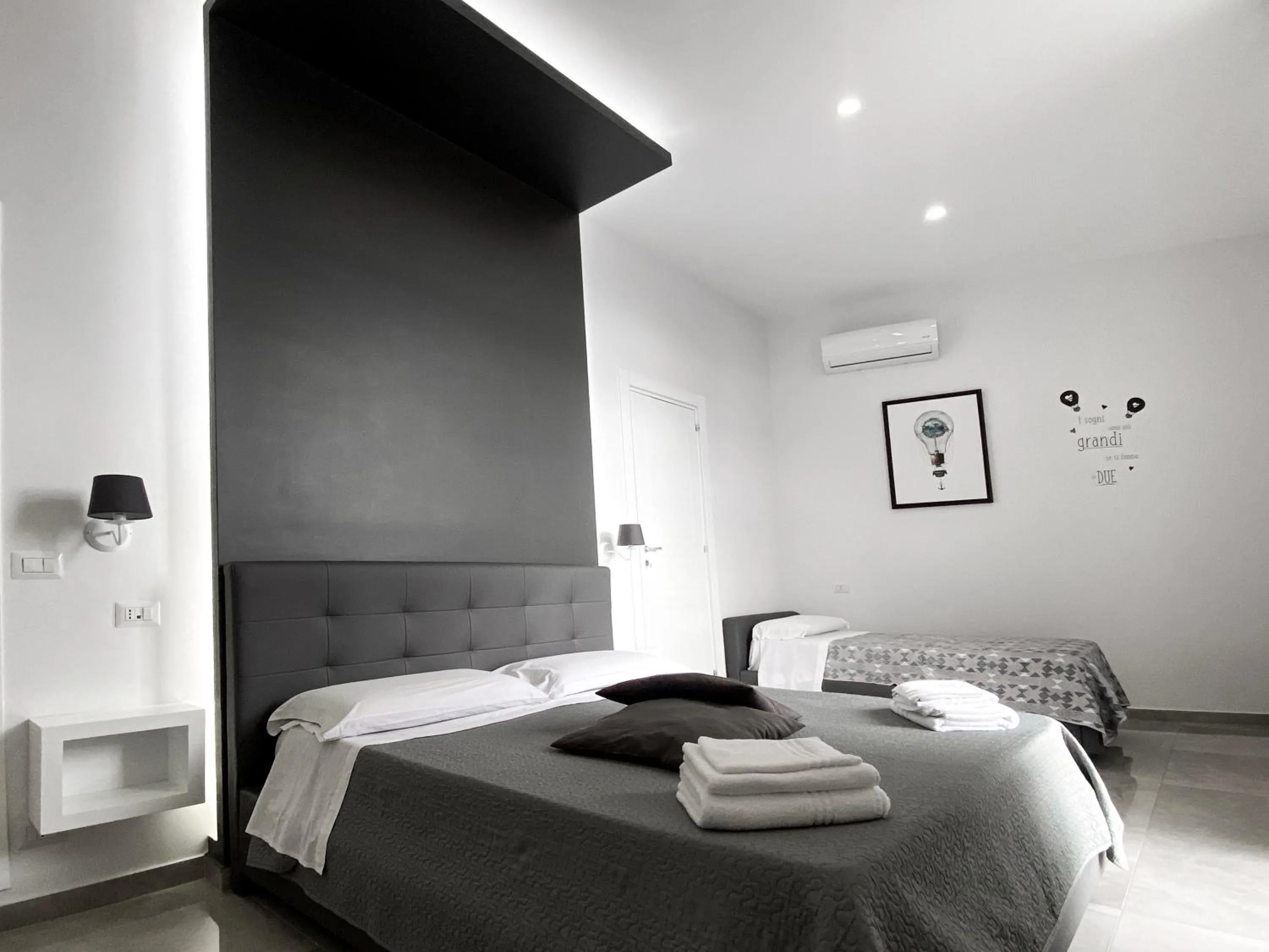 Bed in Aurora Luxury Rooms
