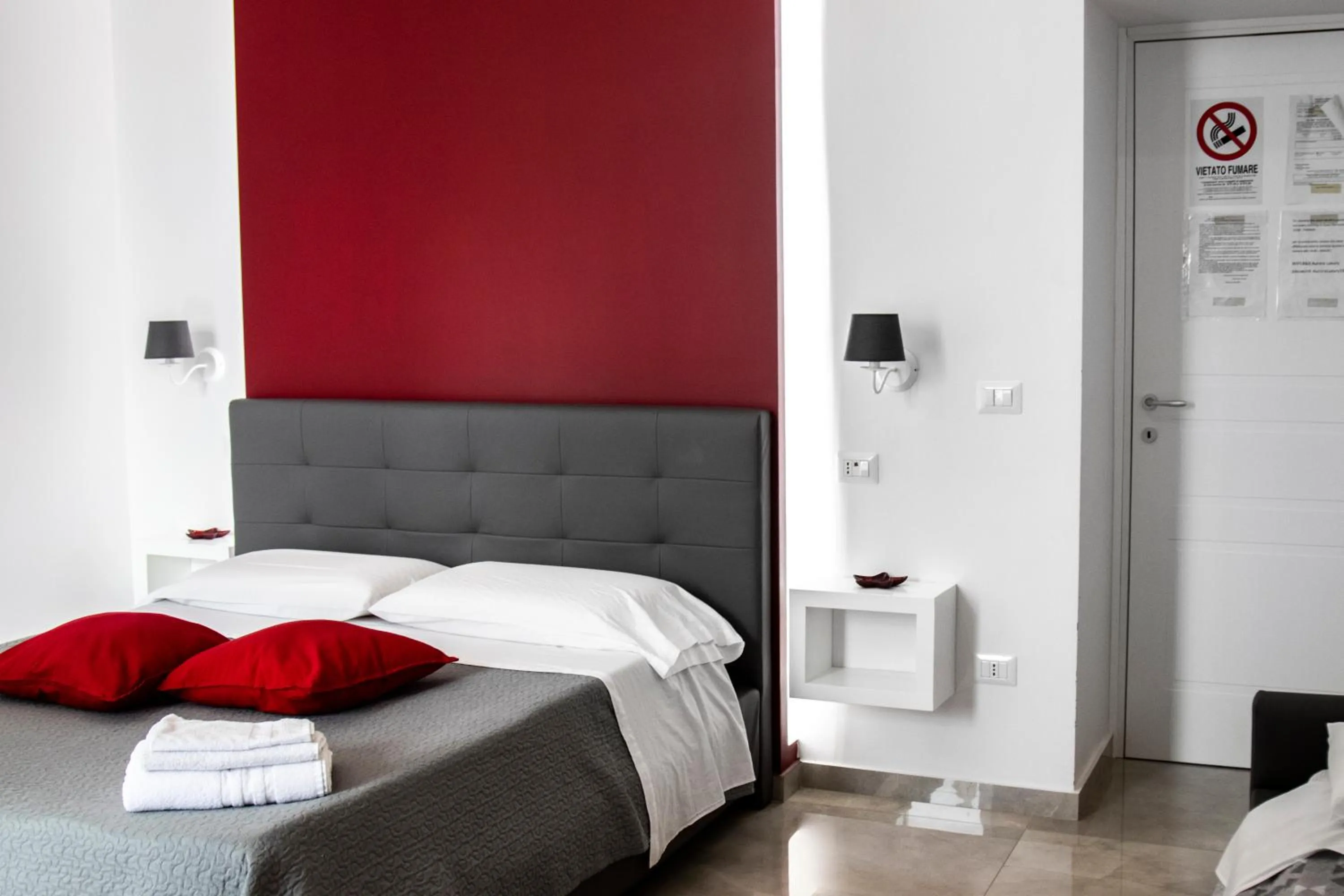 Bed in Aurora Luxury Rooms
