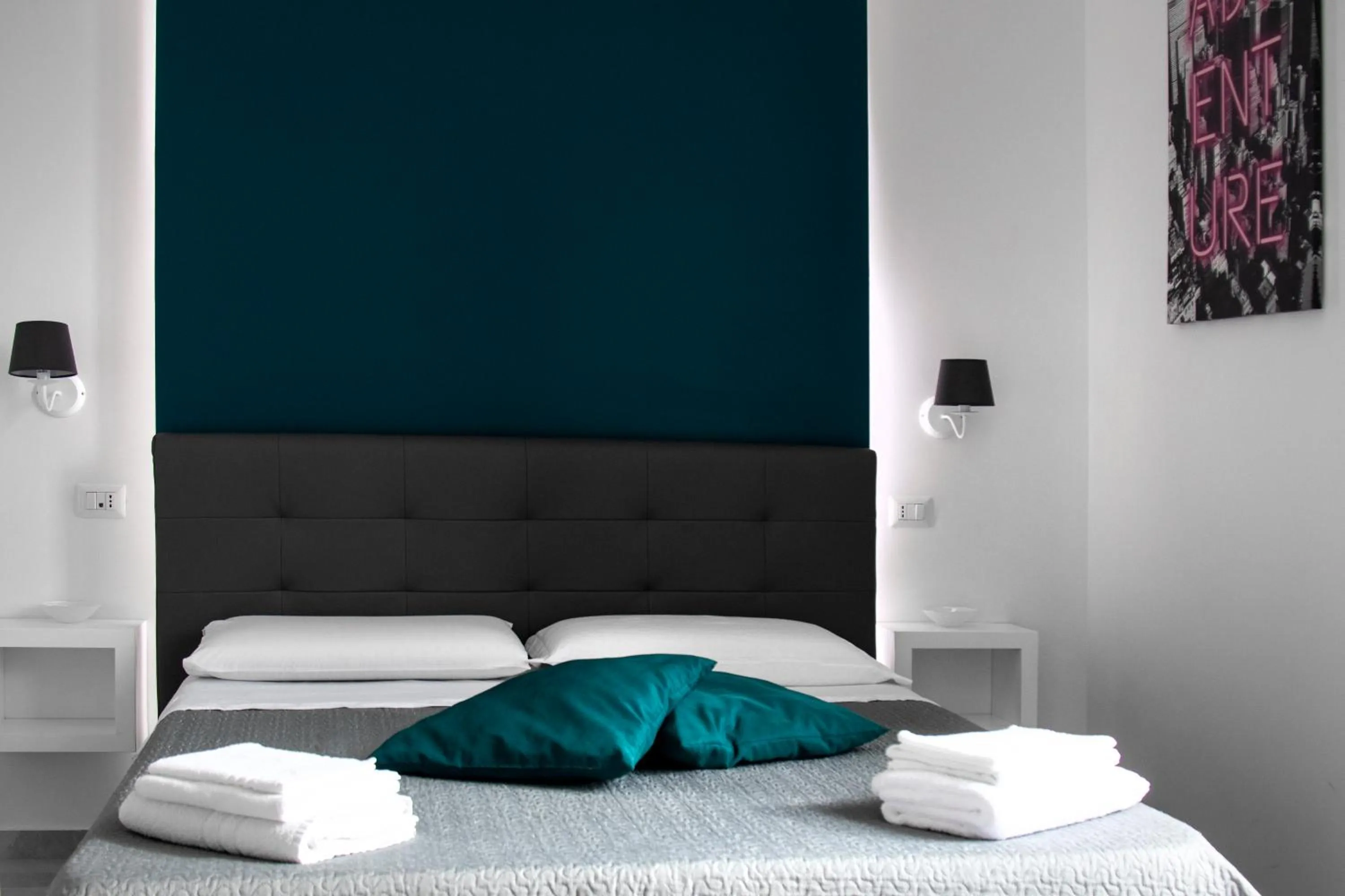 Bed in Aurora Luxury Rooms