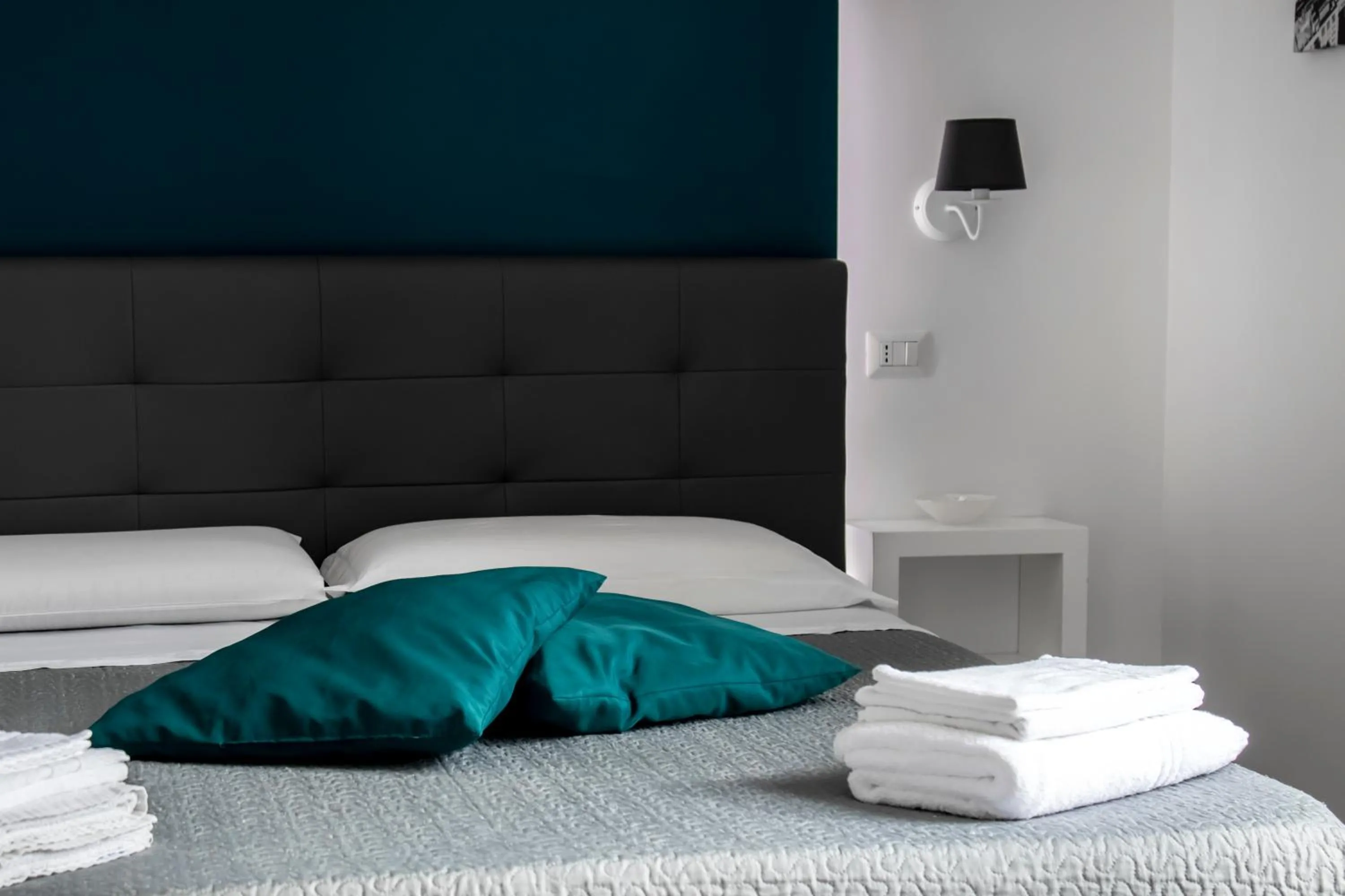 Bed in Aurora Luxury Rooms
