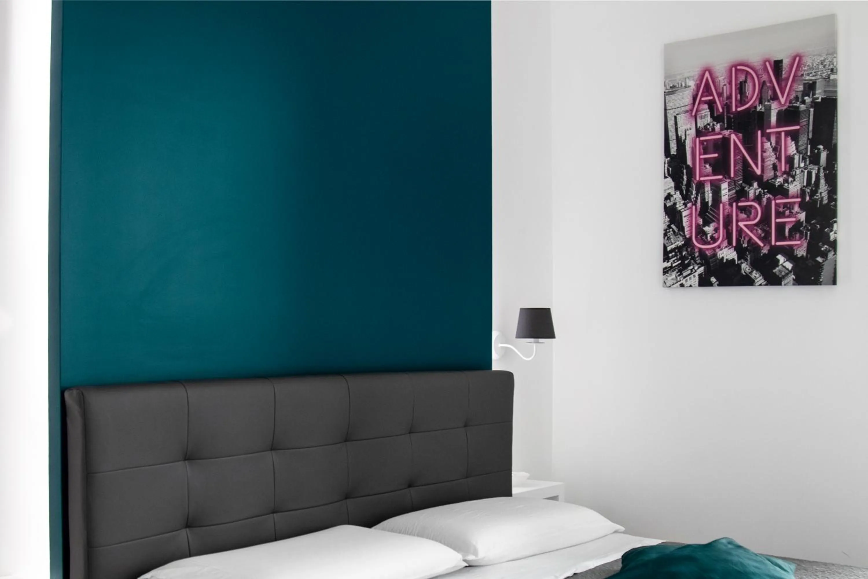 Bed in Aurora Luxury Rooms